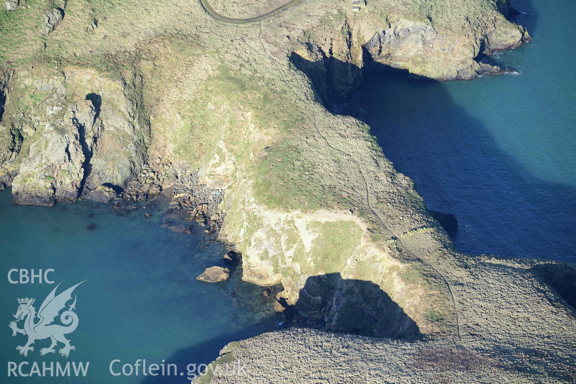 Aerial photo of Skomer Neck.  Aerial reconnaissance survey for the CHERISH Project. Crown Copyright: CHERISH PROJECT 2018. Produced with EU funds through the Ireland Wales Co-operation Programme 2014-2020. All material made freely available through the Open Government Licence.