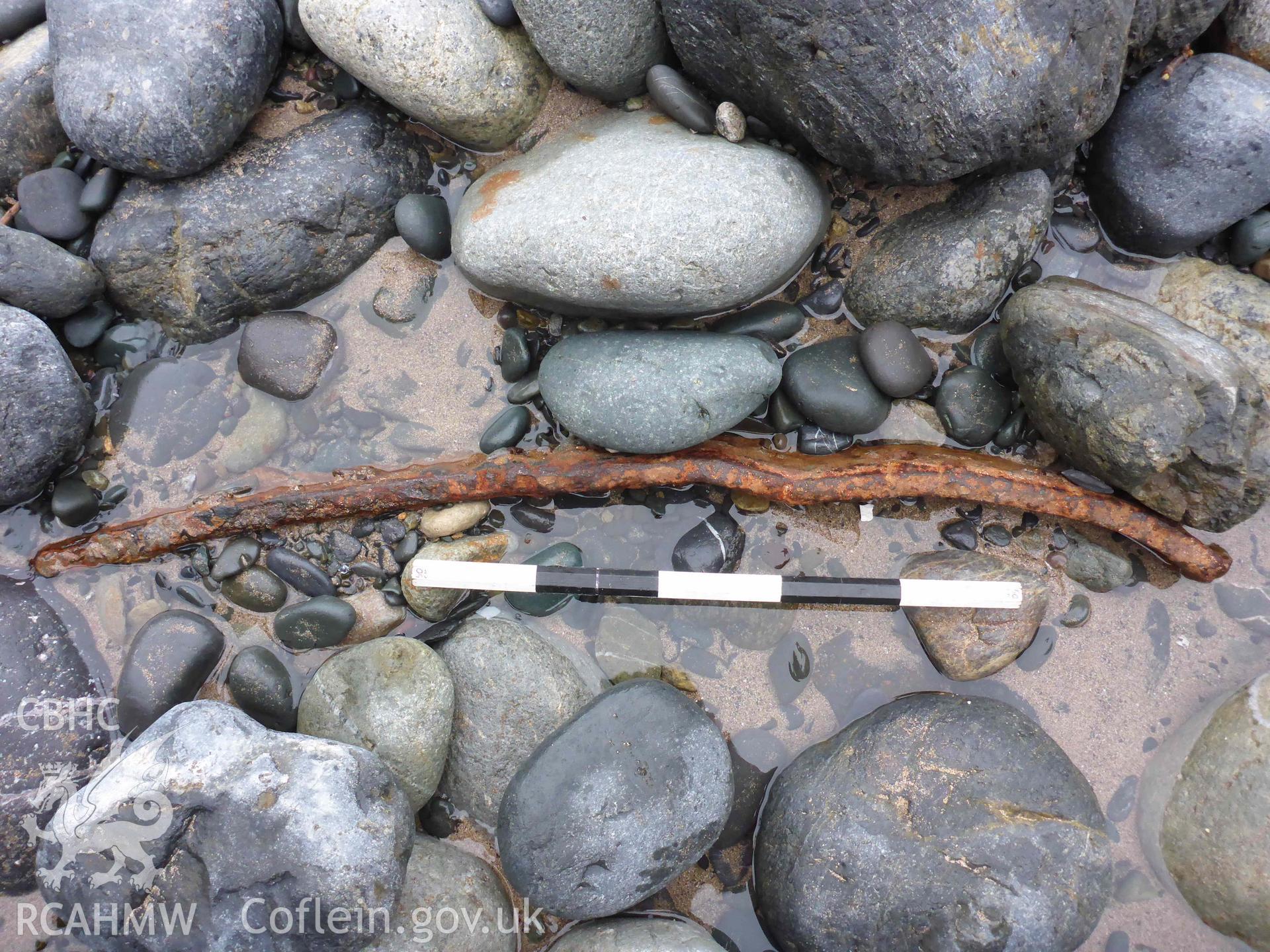 Section of metal strap, likely to be a framing strap, from the wreck of the NIDELV, exposed on Musselwick Sands on 13/01/2025. Scale is 0.5m.