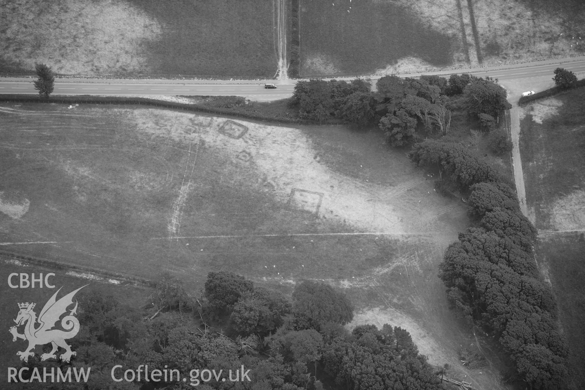 Aerial photograph: Croes Faen, cropmarks of square barrow cemetery. Crown: CHERISH PROJECT 2018. Produced with EU funds through the Ireland Wales Co-operation Programme 2014-2020 (NGR SH598018)