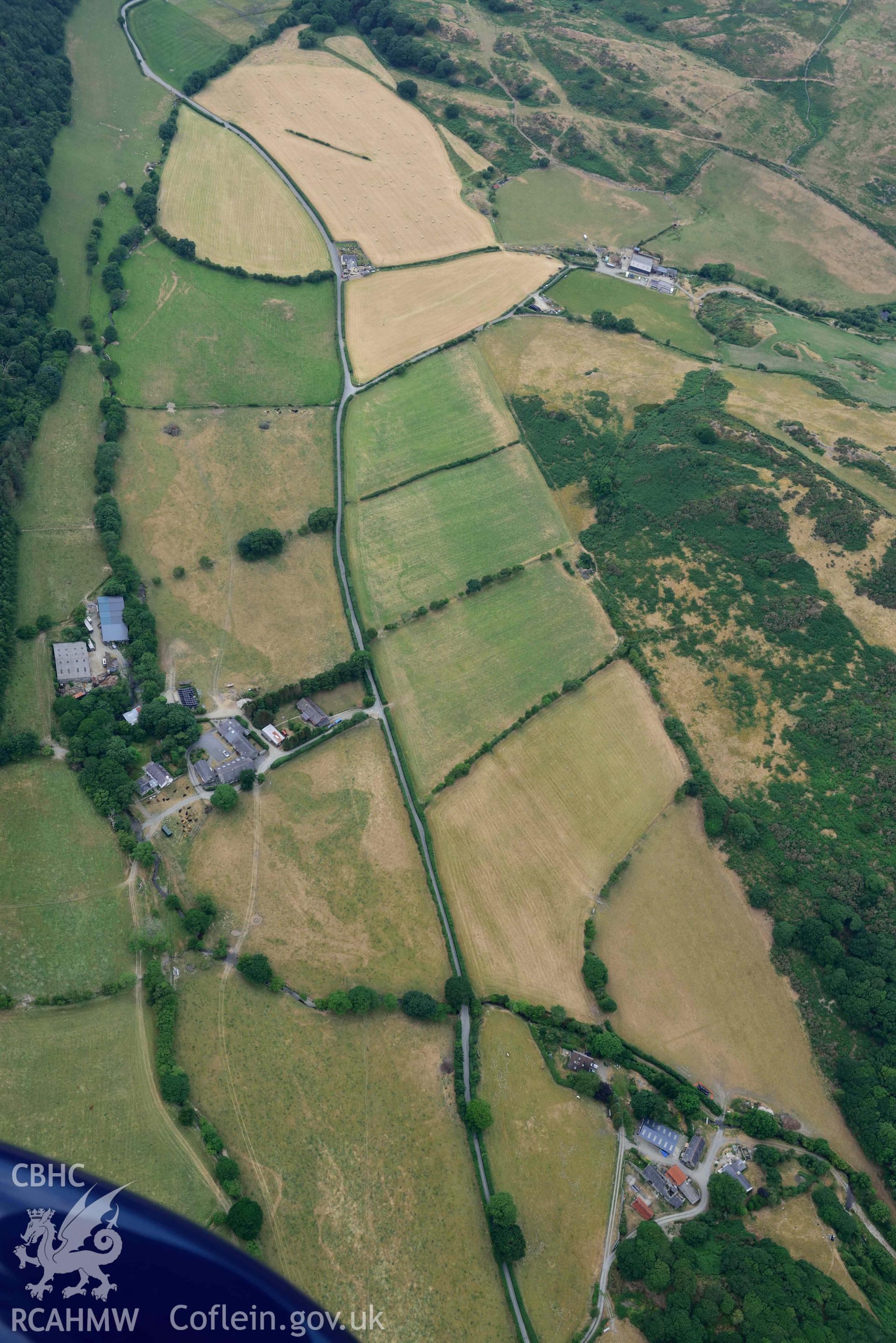 Aerial photograph: Allt-lwyd, Cwm Maethlon round barrow cropmarks. Crown: CHERISH PROJECT 2018. Produced with EU funds through the Ireland Wales Co-operation Programme 2014-2020 (NGR SH631985)