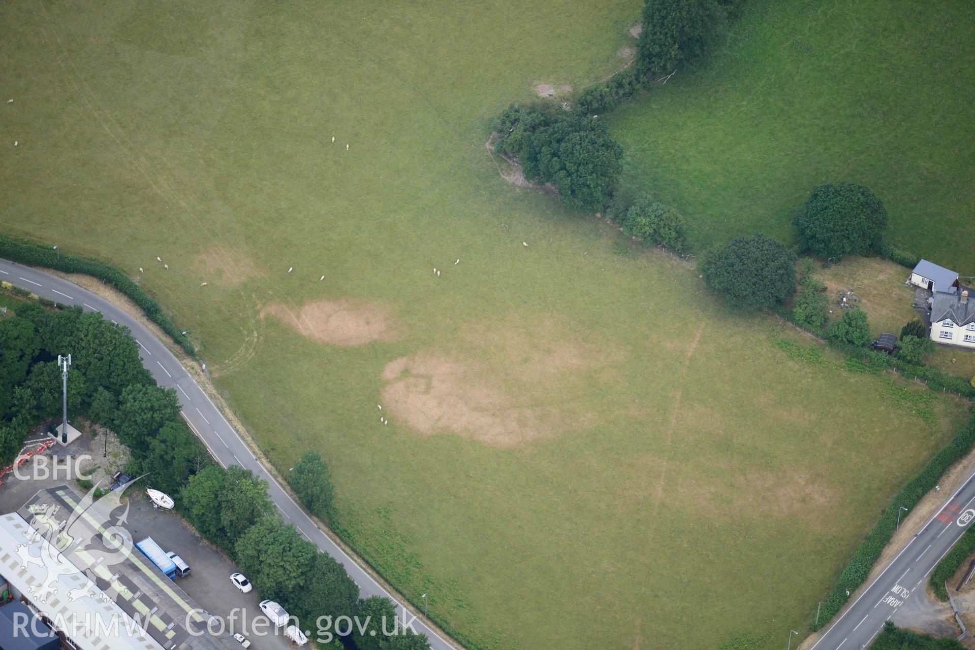 Aerial photograph: Bryncrug, Pont y Felindre, square barrow cemetery. Crown: CHERISH PROJECT 2018. Produced with EU funds through the Ireland Wales Co-operation Programme 2014-2020 (NGR SH613032)