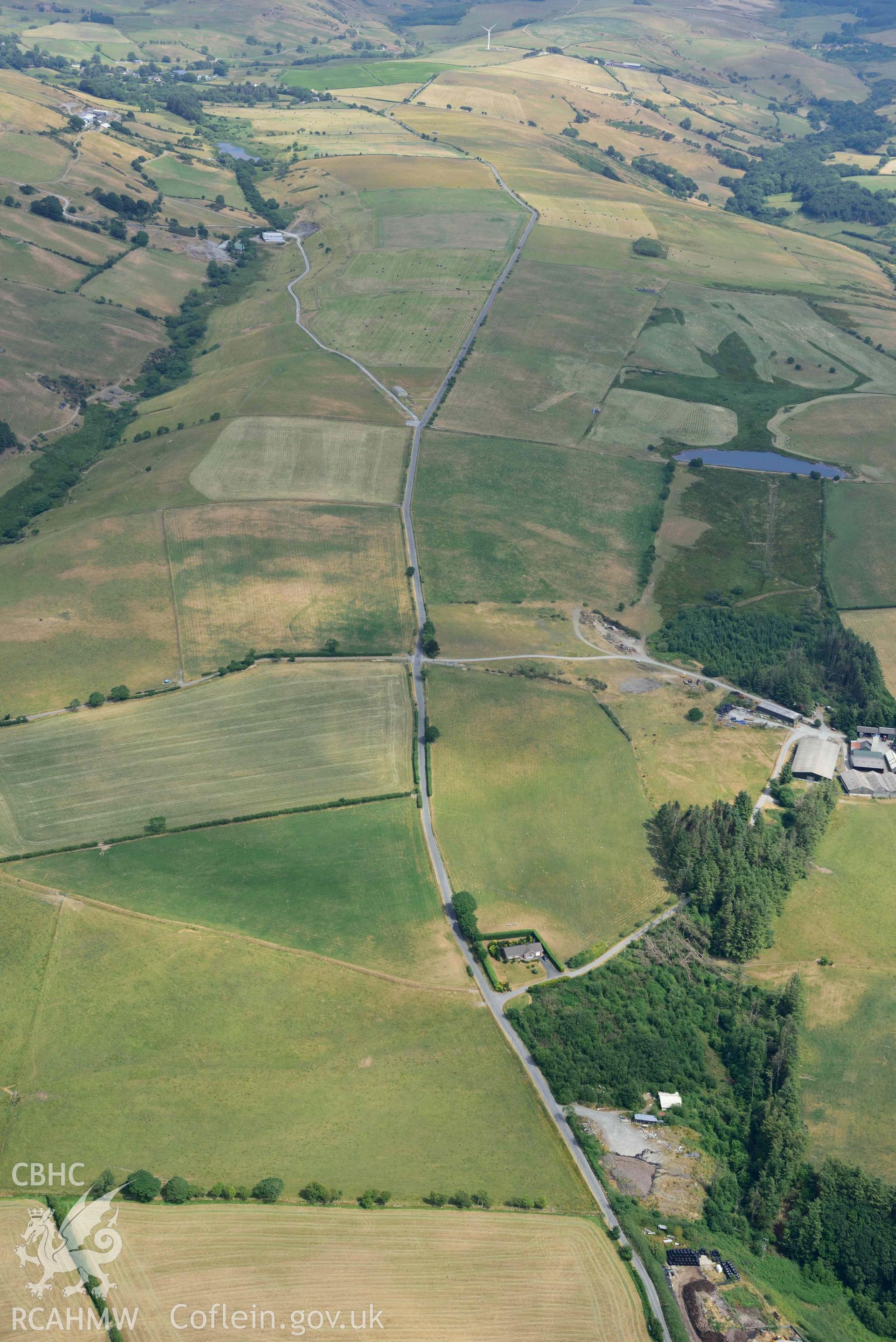 Aerial photograph: Court Grange Lead Mine; landscape from west with parchmarks. Crown: CHERISH PROJECT 2018. Produced with EU funds through the Ireland Wales Co-operation Programme 2014-2020 (NGR SN655855)