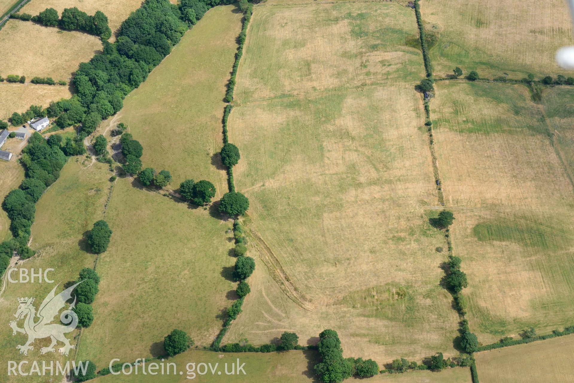 Aerial photograph: Gellifadog defended enclosure cropmark, view from west. Crown: CHERISH PROJECT 2018. Produced with EU funds through the Ireland Wales Co-operation Programme 2014-2020 (NGR SN654821)