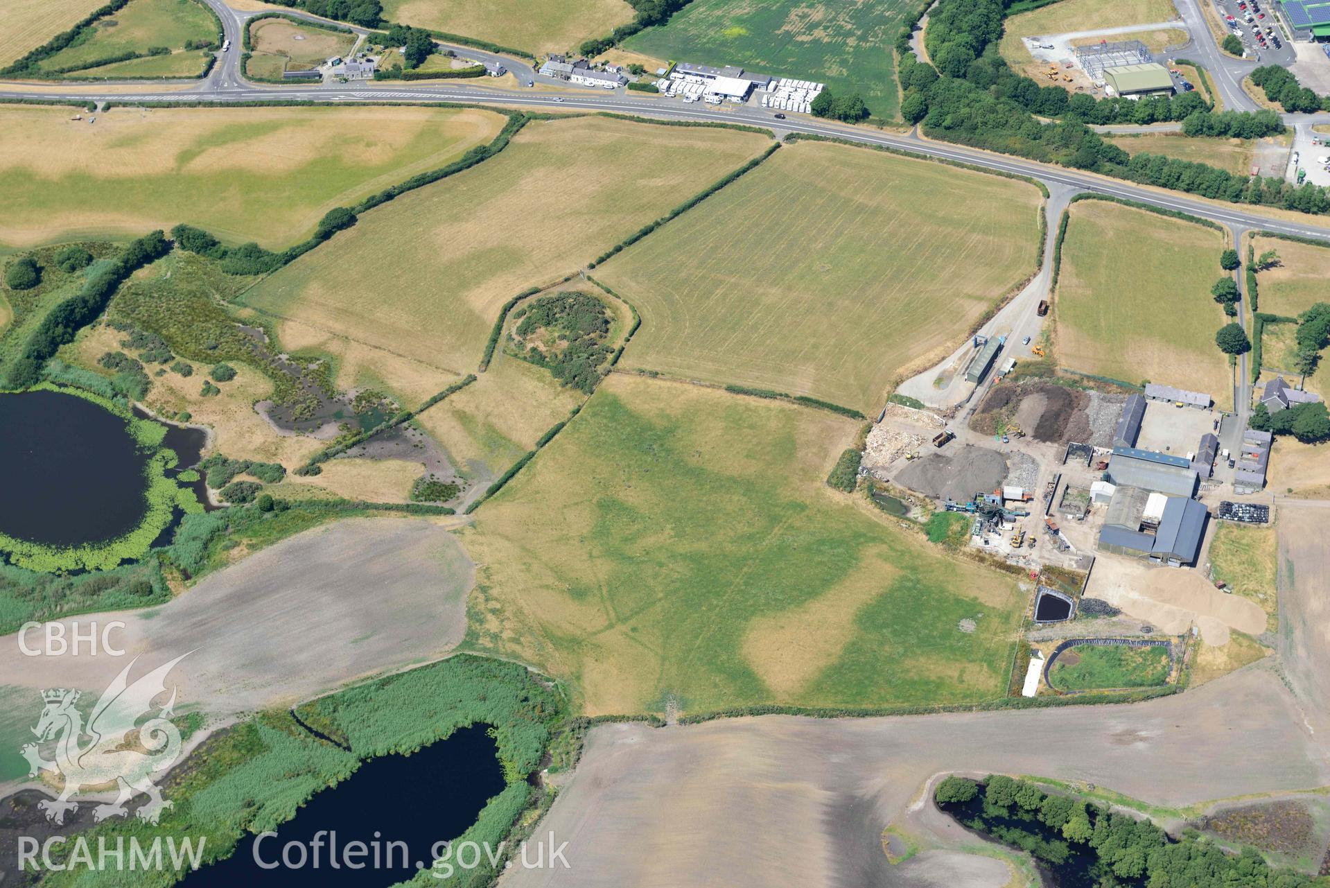 Aerial photograph: Tomen Fawr ringwork, and cropmarks. Crown: CHERISH PROJECT 2018. Produced with EU funds through the Ireland Wales Co-operation Programme 2014-2020 (NGR SH454376)