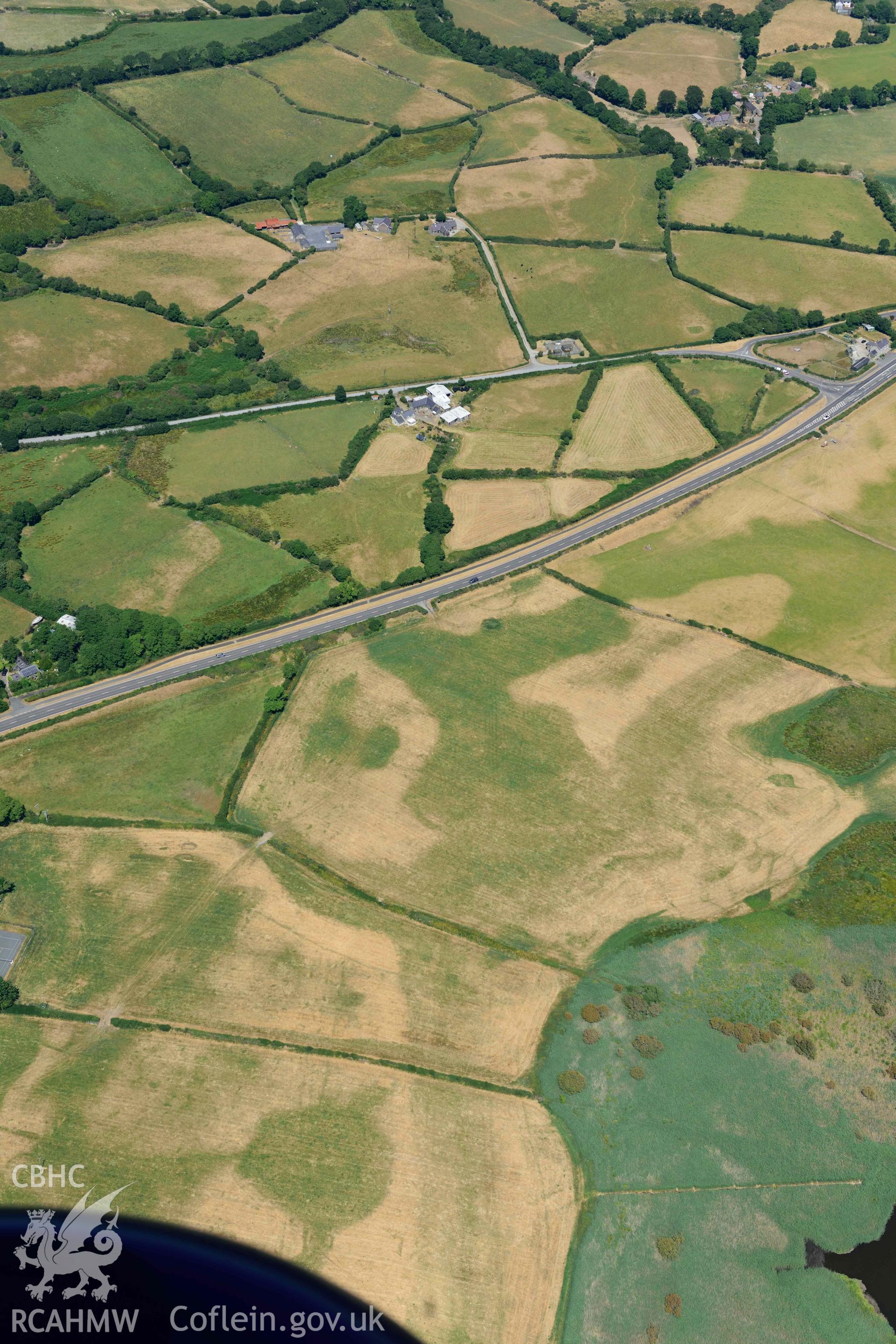 Aerial photograph: Hen-Efail cropmark enclosure. Crown: CHERISH PROJECT 2018. Produced with EU funds through the Ireland Wales Co-operation Programme 2014-2020 (NGR SH449377)