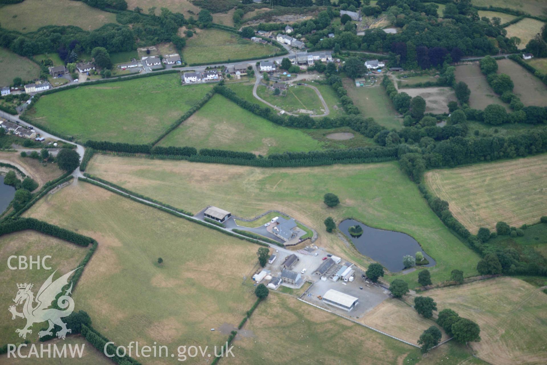 Aerial photograph: Maescanol house (SN53314535), Pencarreg. Parchmarks of ground source heating system installed circa 2011, showing to south of bungalow. Crown: CHERISH PROJECT 2018. Produced with EU funds through the Ireland Wales Co-operation Programme 2014-2020 (NGR SN532453)