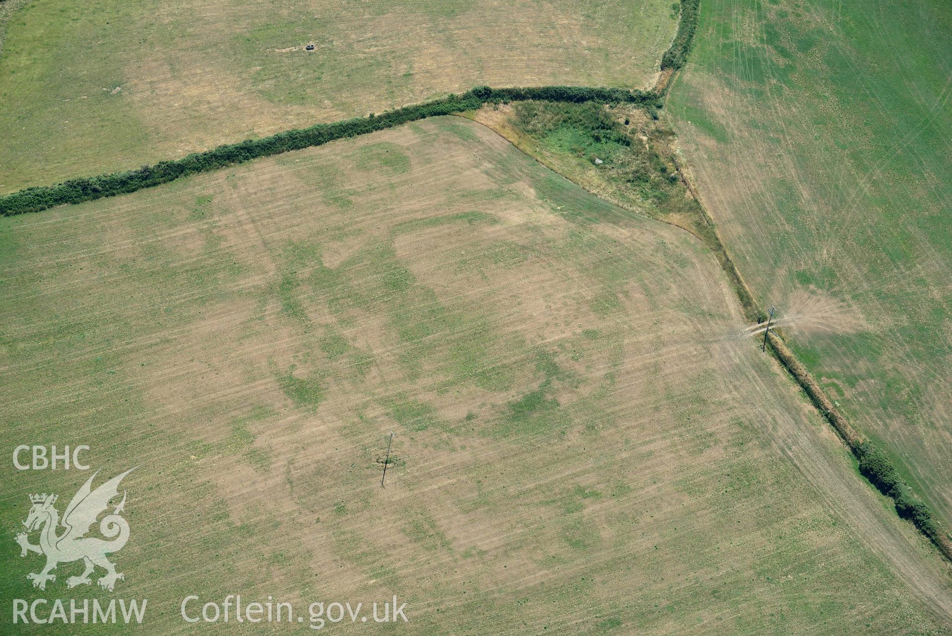 Aerial photograph: Bryniau or Bryn Rhydd cropmark enclosure, wide view from south. Crown: CHERISH PROJECT 2018. Produced with EU funds through the Ireland Wales Co-operation Programme 2014-2020 (NGR SH265387)