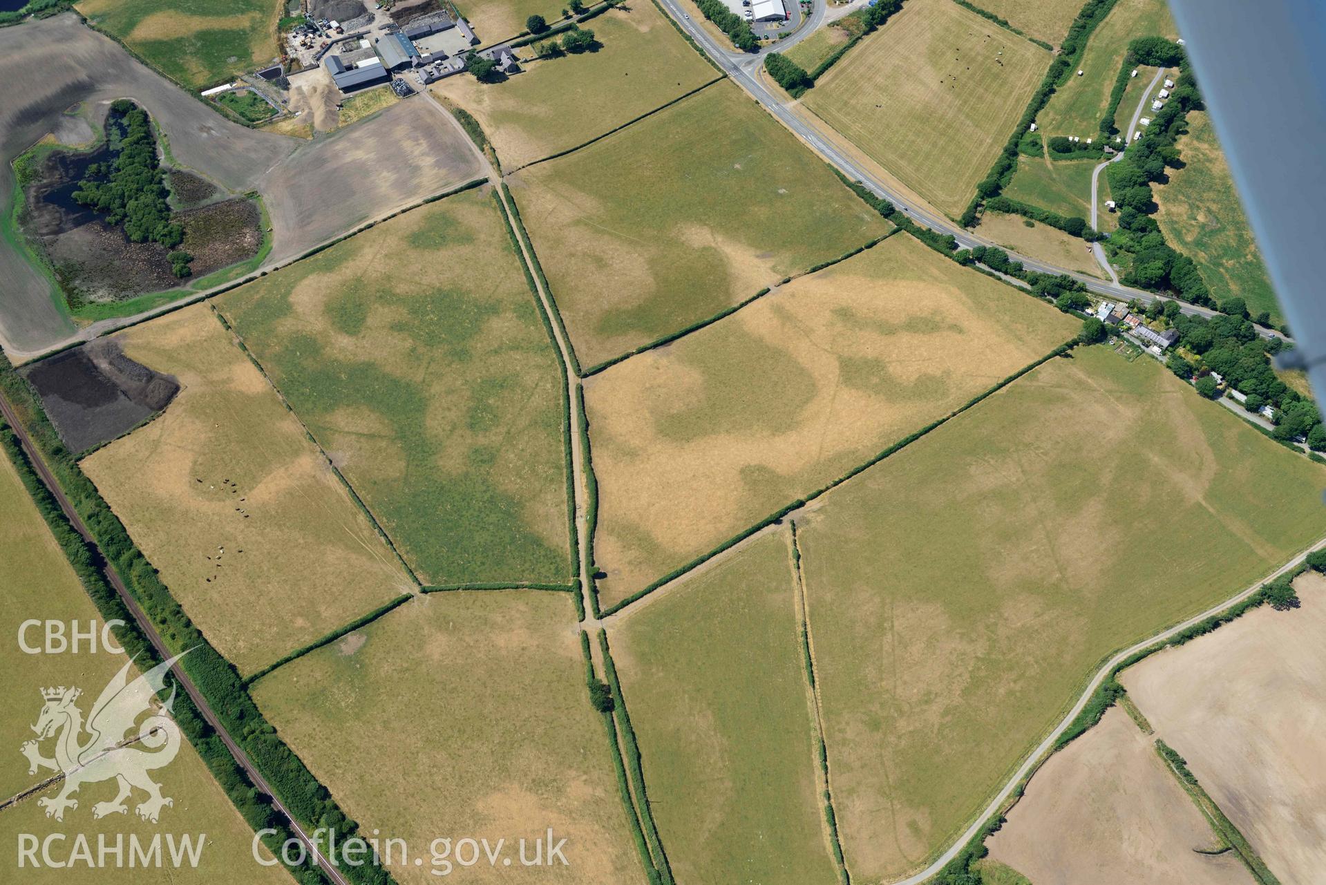 Aerial photograph: Glanllynnau early field system cropmarks, view from east. Crown: CHERISH PROJECT 2018. Produced with EU funds through the Ireland Wales Co-operation Programme 2014-2020 (NGR SH458376)