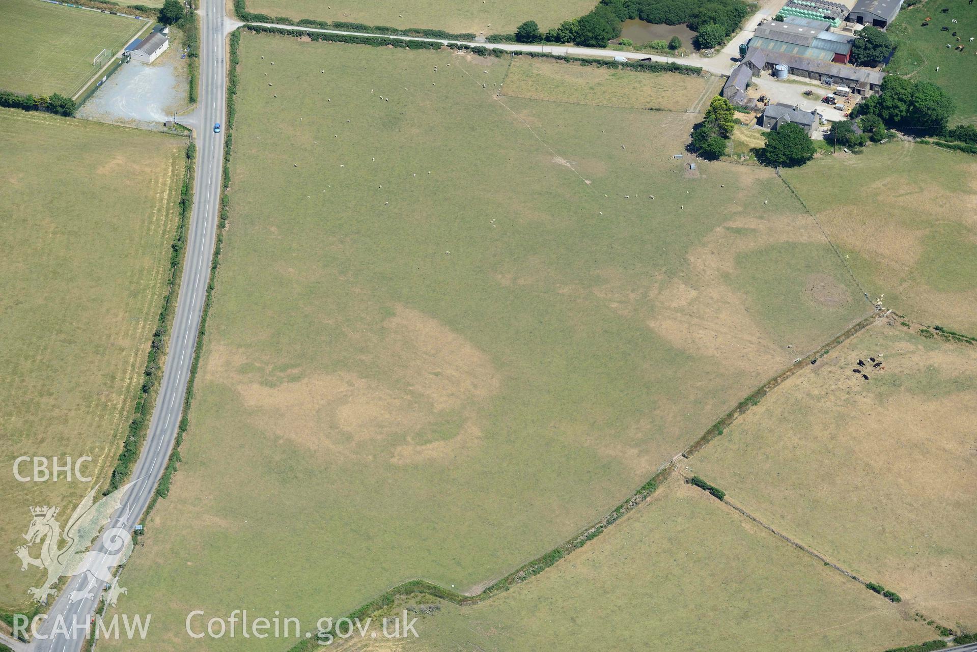 Aerial photograph: Bodtacho Ddu, prehistoric defended enclosure and cropmarks. Crown: CHERISH PROJECT 2018. Produced with EU funds through the Ireland Wales Co-operation Programme 2014-2020 (NGR SH299394)