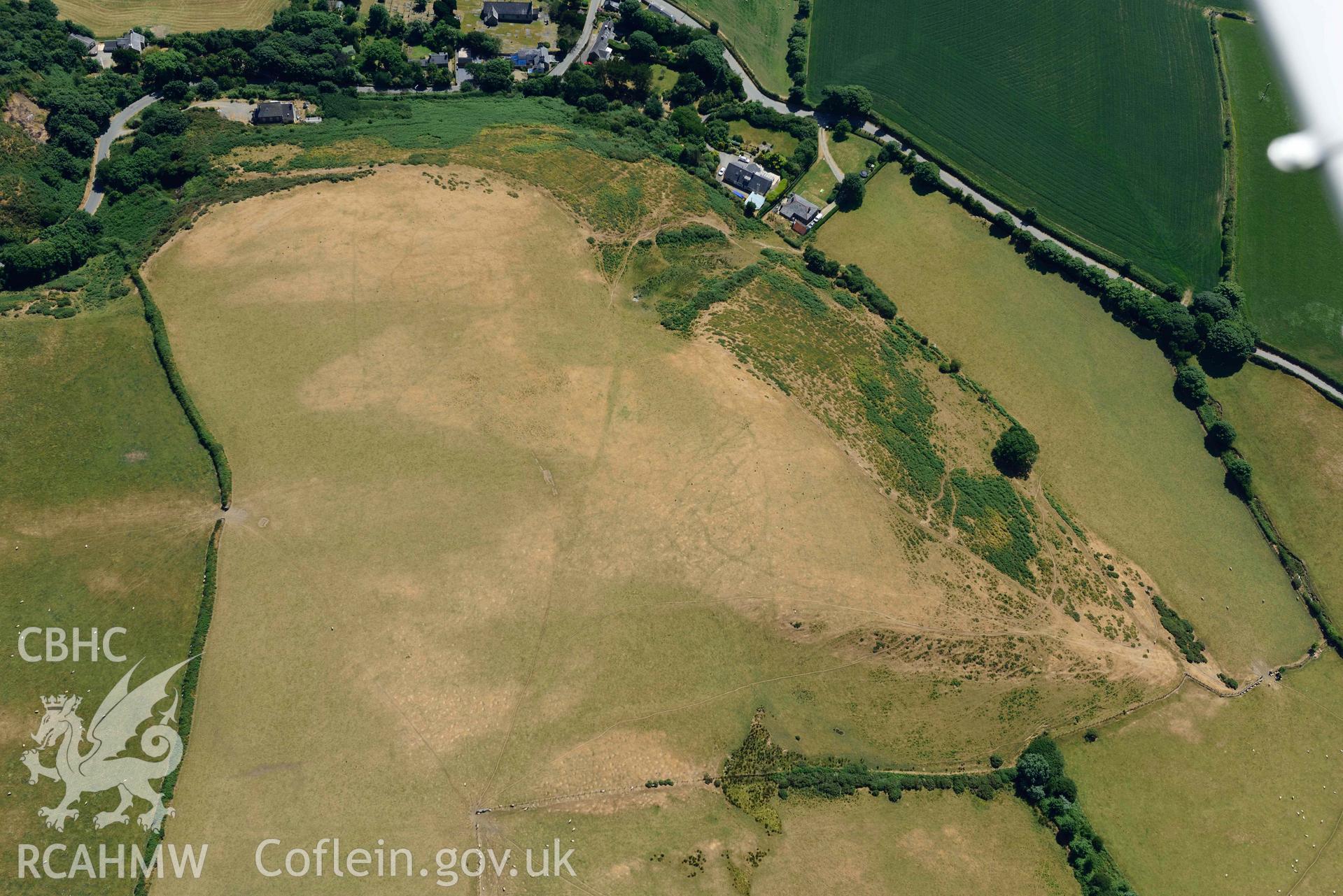 Aerial photograph: Llangian: cropmarks of early promontory enclosure, from north. Crown: CHERISH PROJECT 2018. Produced with EU funds through the Ireland Wales Co-operation Programme 2014-2020 (NGR SH294292)