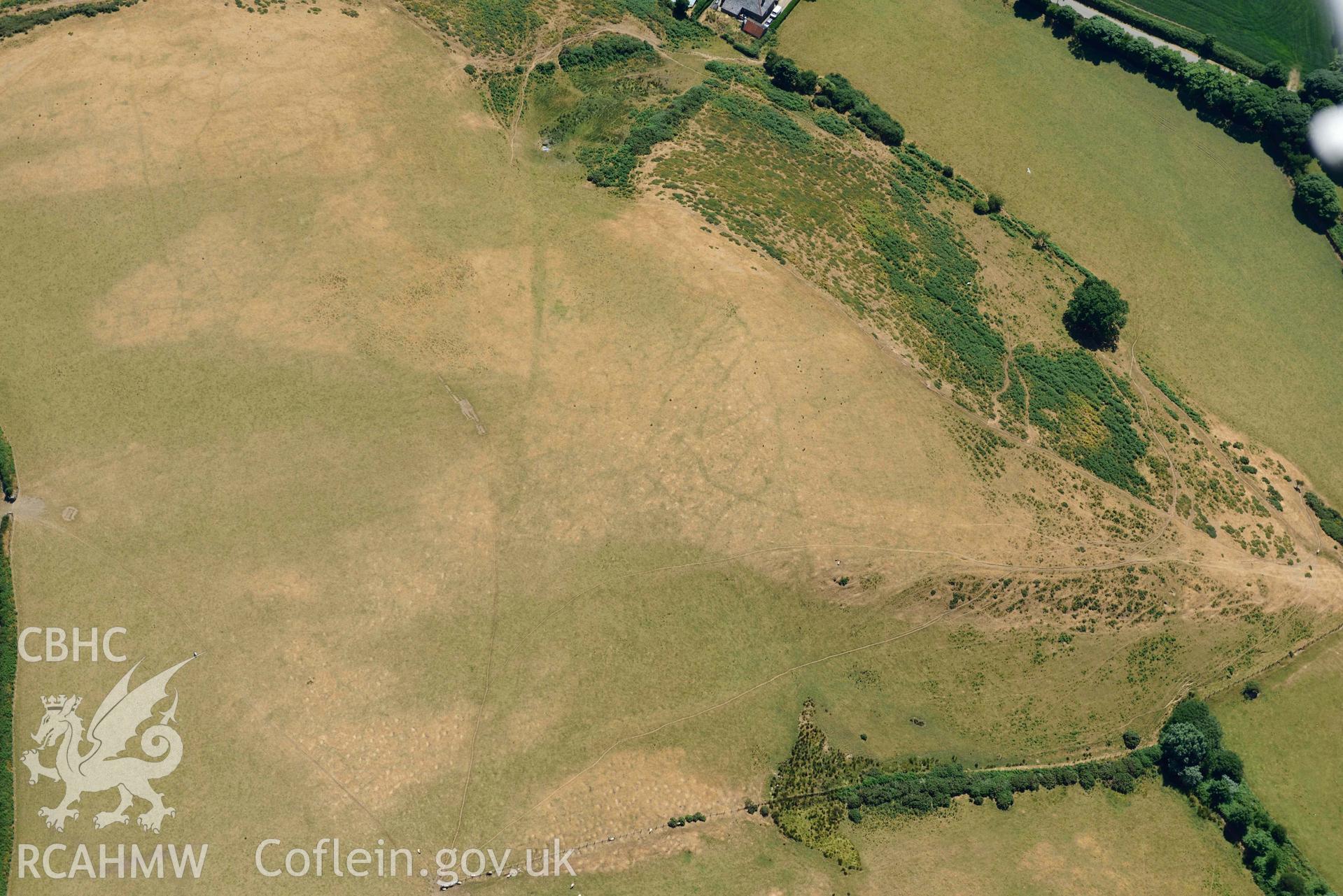 Aerial photograph: Llangian: cropmarks of early promontory enclosure, from north. Crown: CHERISH PROJECT 2018. Produced with EU funds through the Ireland Wales Co-operation Programme 2014-2020 (NGR SH294292)