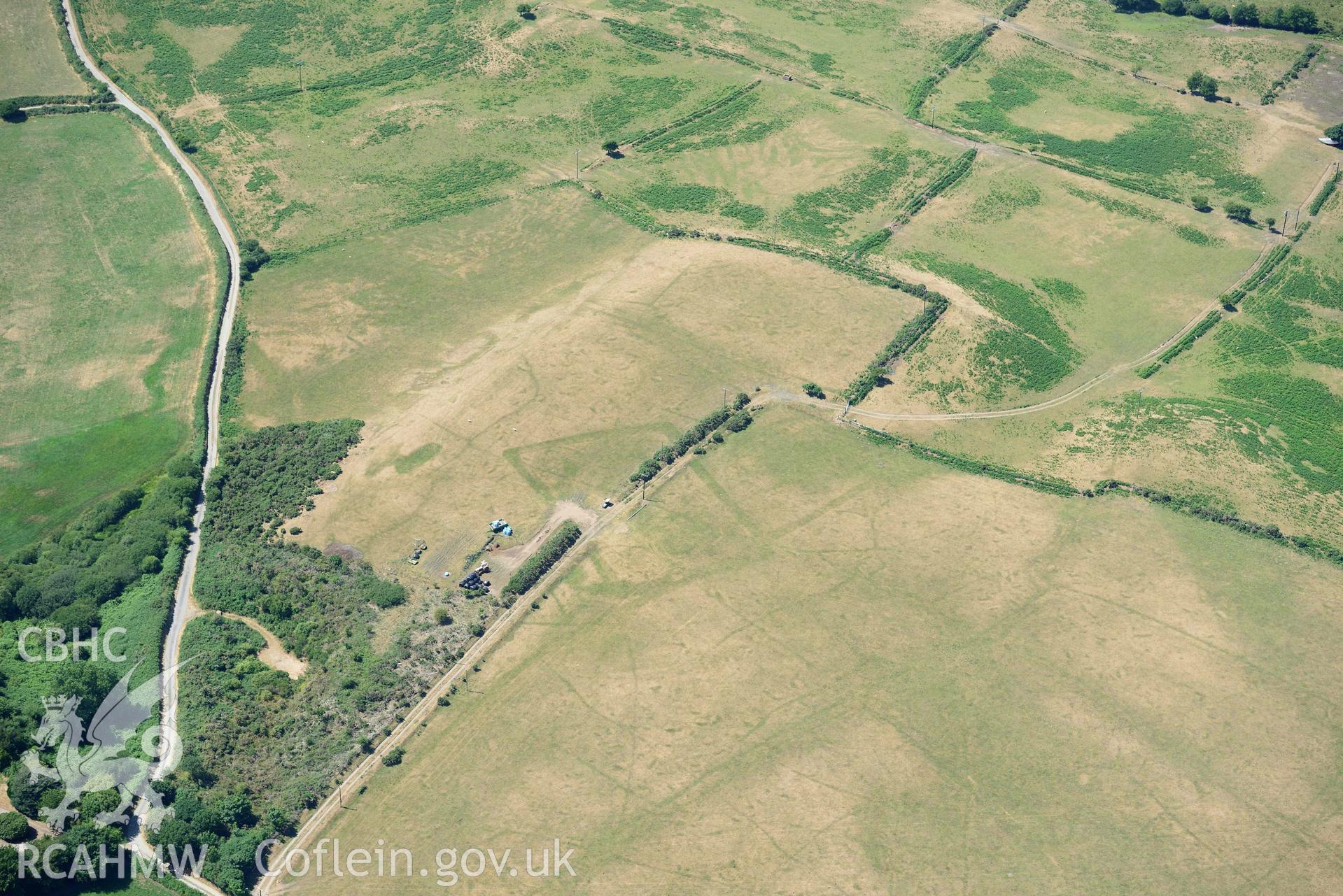 Aerial photograph: Traian bilvallate cropmark enclosure. Crown: CHERISH PROJECT 2018. Produced with EU funds through the Ireland Wales Co-operation Programme 2014-2020 (NGR SH329366)