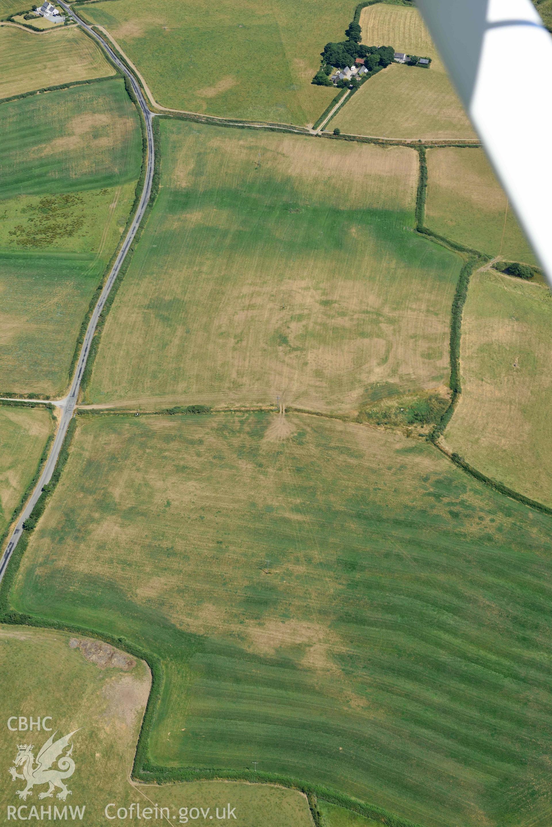 Aerial photograph: Bryniau or Bryn Rhydd cropmark enclosure. Crown: CHERISH PROJECT 2018. Produced with EU funds through the Ireland Wales Co-operation Programme 2014-2020 (NGR SH265387)