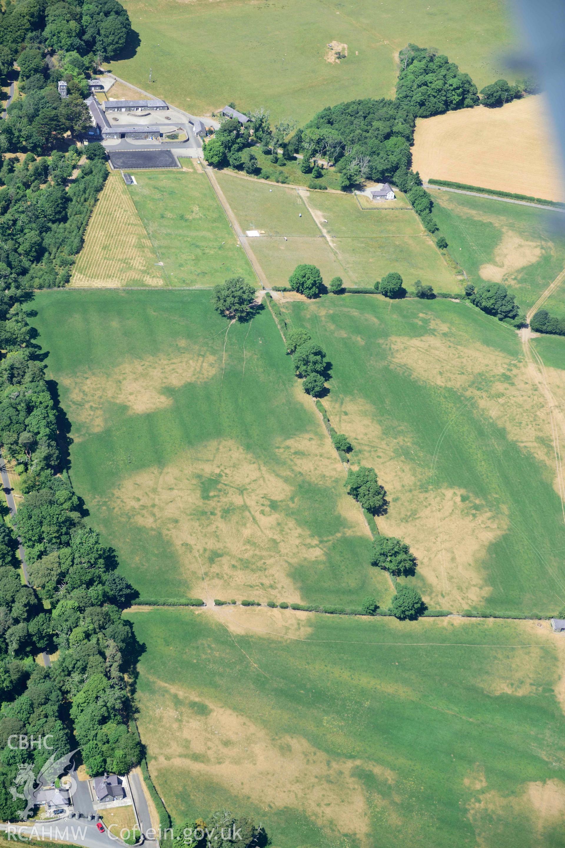 Aerial photograph: Broom Hall parkland; sundry cropmarks of relict field systems to south-east of stables. Crown: CHERISH PROJECT 2018. Produced with EU funds through the Ireland Wales Co-operation Programme 2014-2020 (NGR SH416369)