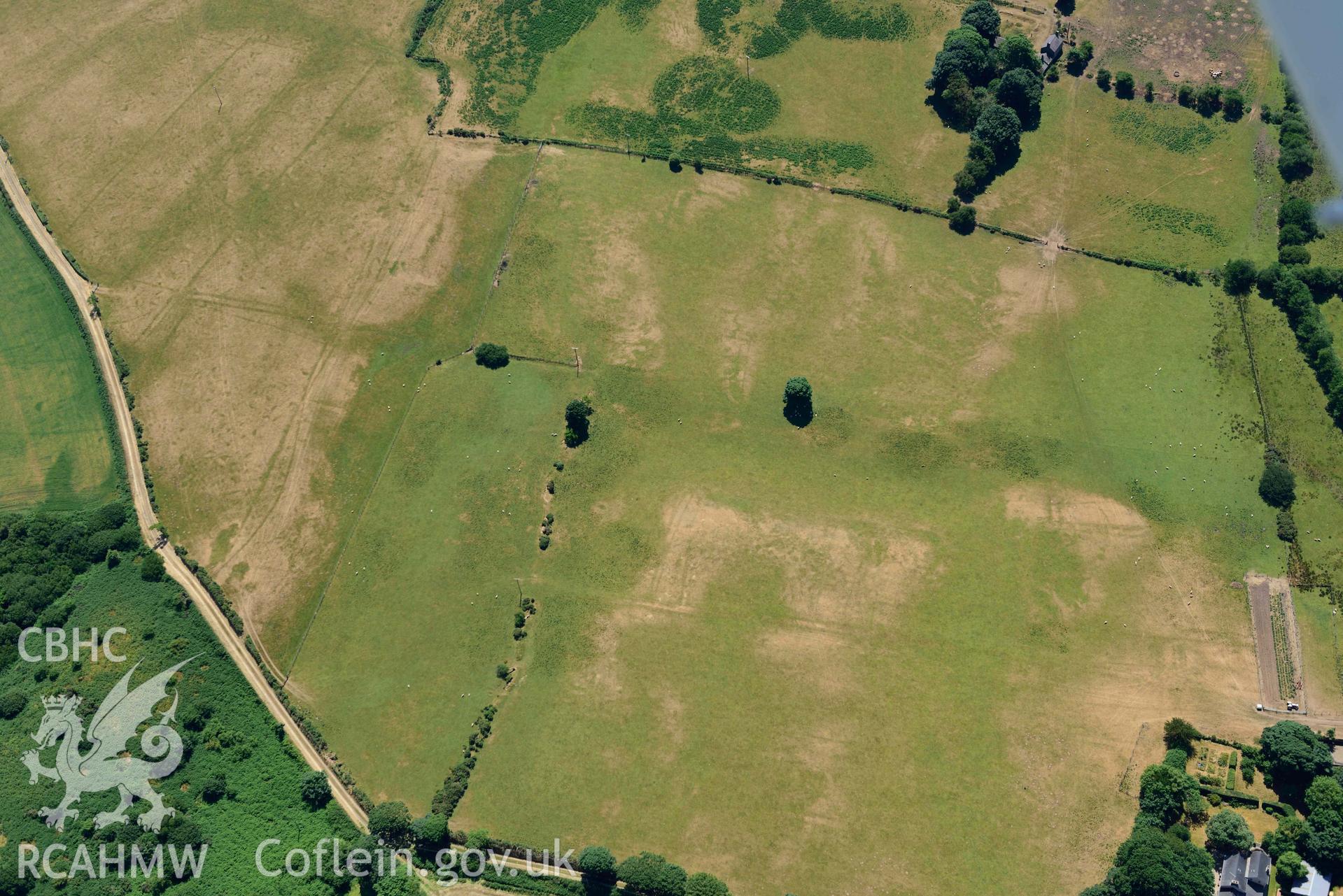 Aerial photograph: Traian bilvallate cropmark enclosure. Crown: CHERISH PROJECT 2018. Produced with EU funds through the Ireland Wales Co-operation Programme 2014-2020 (NGR SH329366)