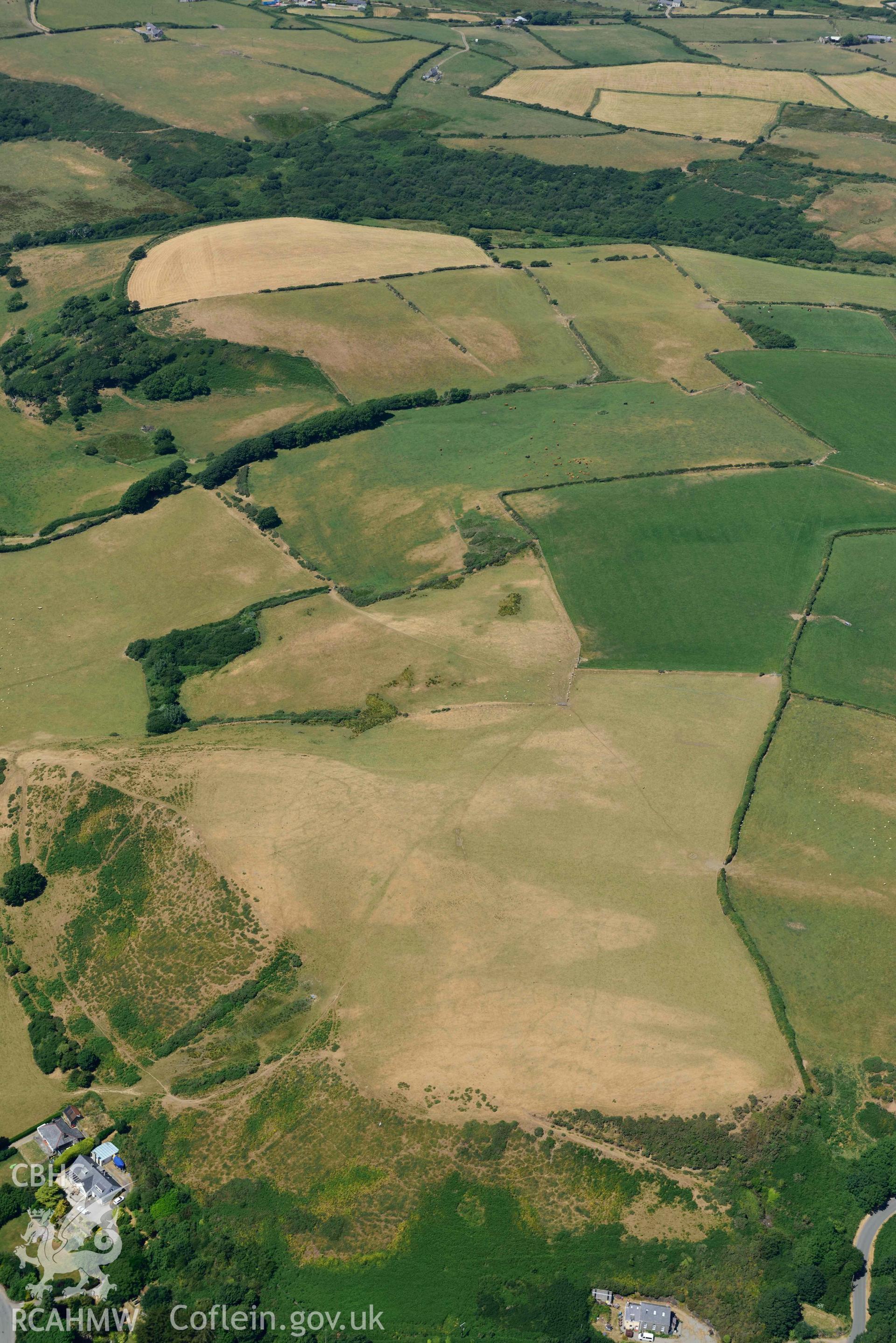 Aerial photograph: Llangian: cropmarks of early promontory enclosure, from north. Crown: CHERISH PROJECT 2018. Produced with EU funds through the Ireland Wales Co-operation Programme 2014-2020 (NGR SH294292)