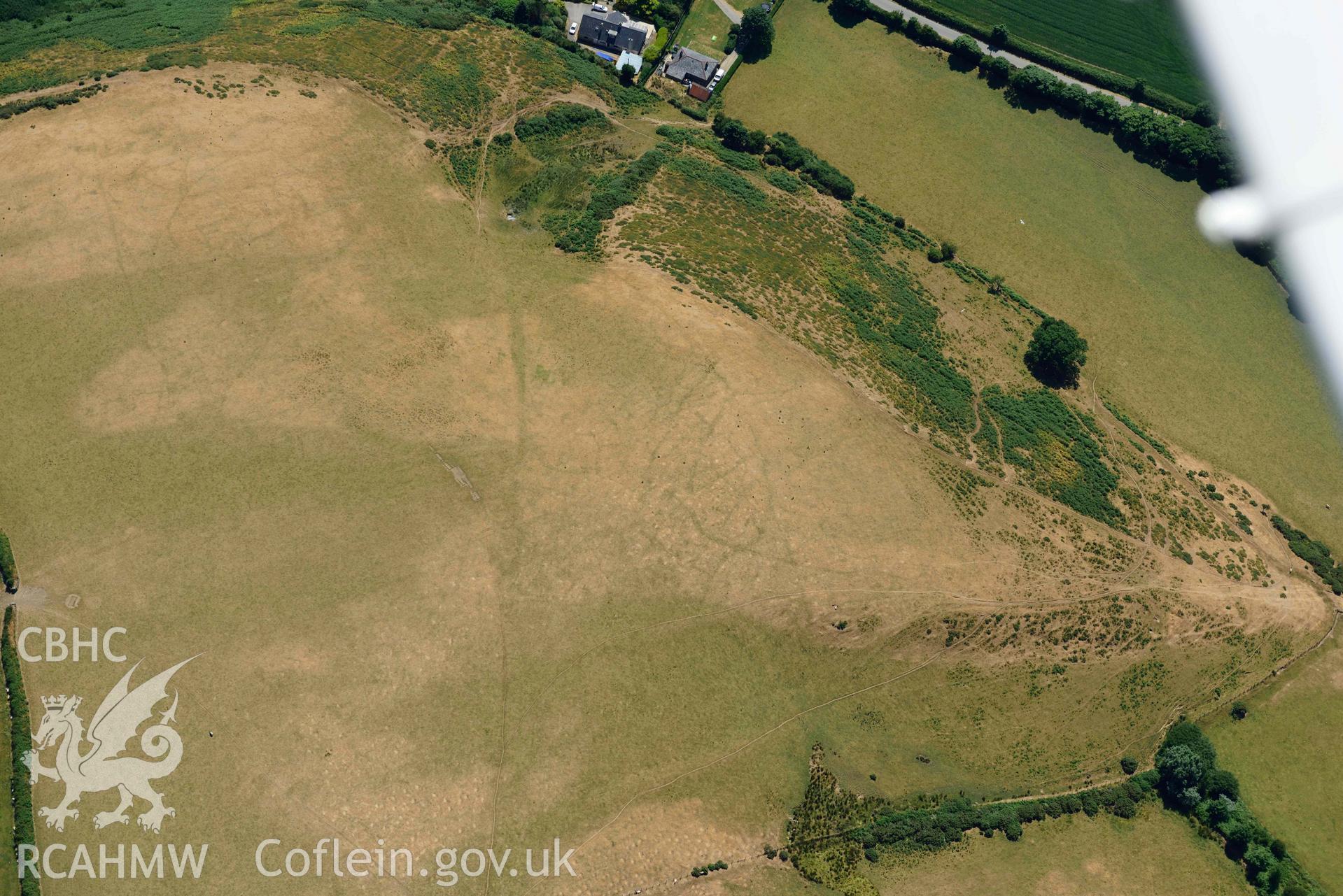 Aerial photograph: Llangian: cropmarks of early promontory enclosure, from north. Crown: CHERISH PROJECT 2018. Produced with EU funds through the Ireland Wales Co-operation Programme 2014-2020 (NGR SH294292)