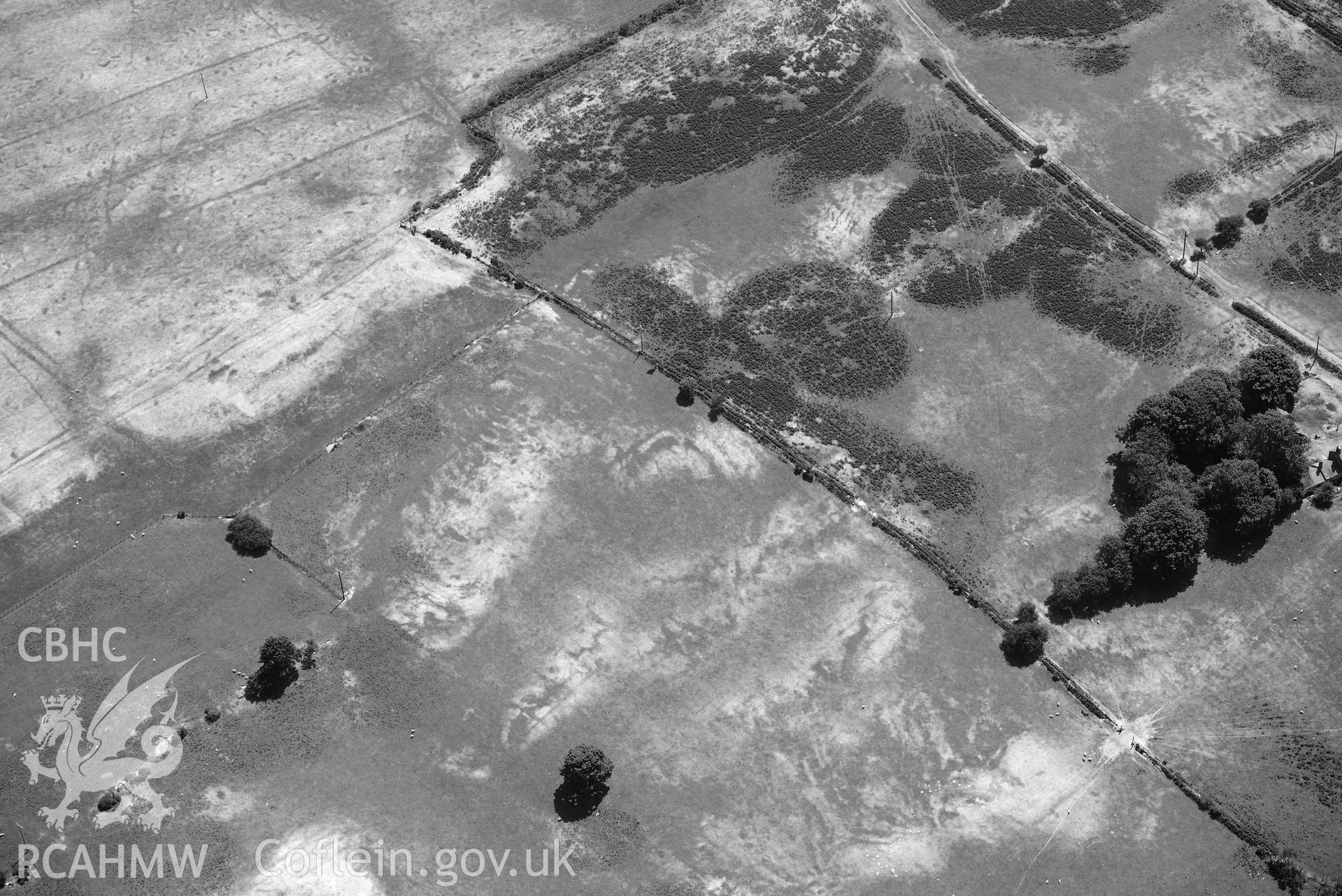 Aerial photograph: Traian bilvallate cropmark enclosure. Crown: CHERISH PROJECT 2018. Produced with EU funds through the Ireland Wales Co-operation Programme 2014-2020 (NGR SH329366)