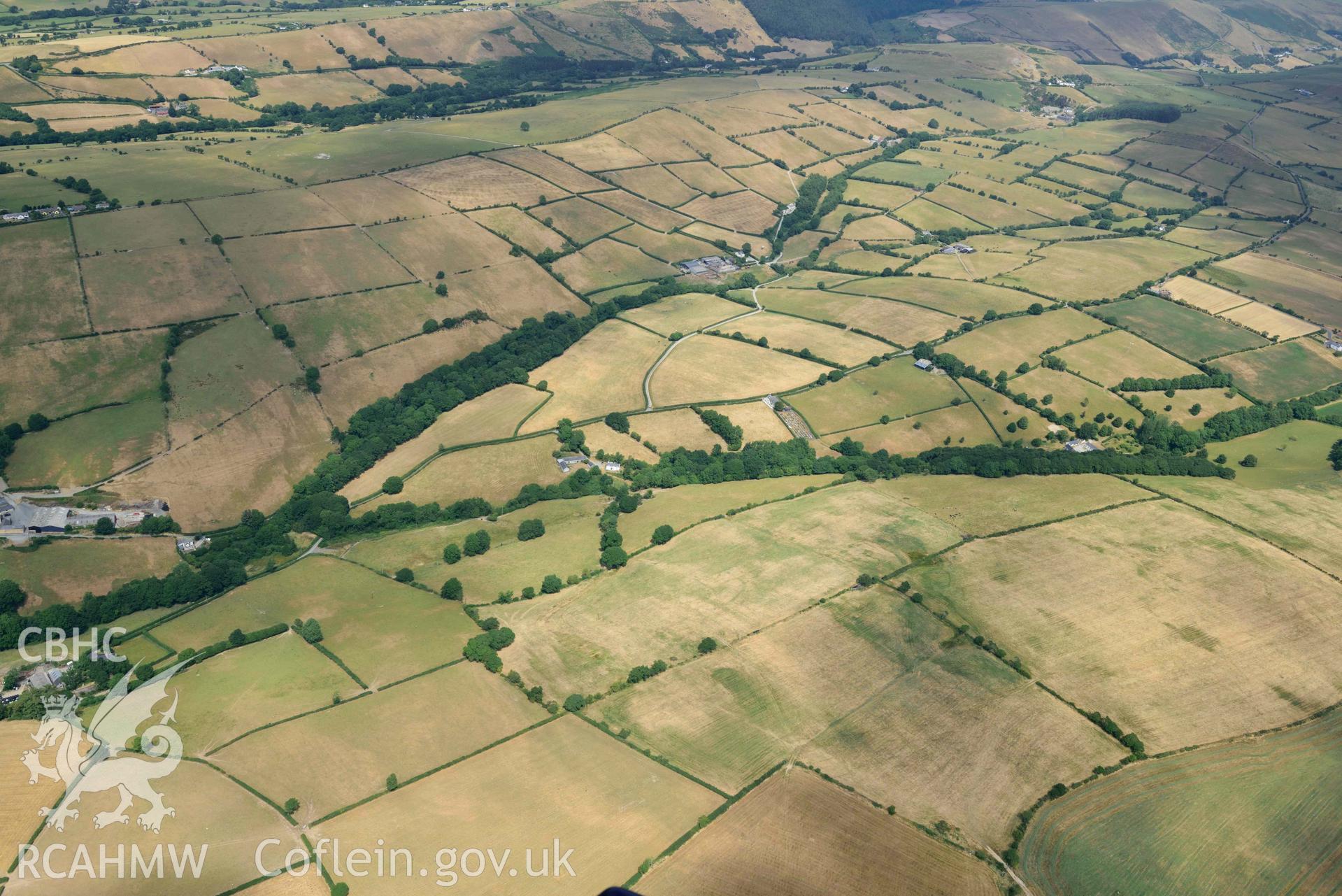 Aerial photograph: Gellifadog defended enclosure cropmark, view from south-west. Crown: CHERISH PROJECT 2018. Produced with EU funds through the Ireland Wales Co-operation Programme 2014-2020 (NGR SN654821)