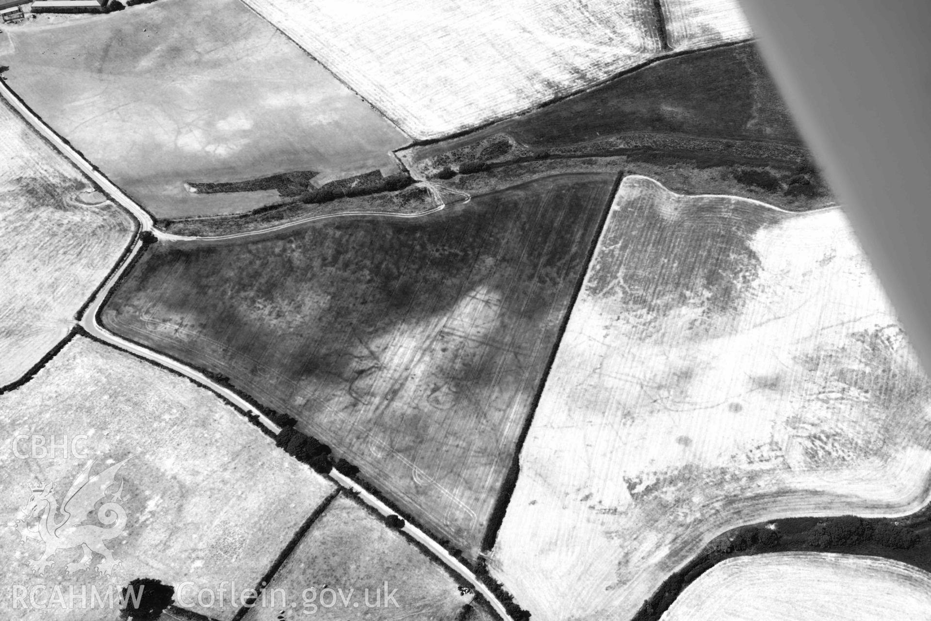 Aerial photograph: Tyddyn Llewelyn, cropmarks of field systems. Crown: CHERISH PROJECT 2018. Produced with EU funds through the Ireland Wales Co-operation Programme 2014-2020 (NGR SH344344)