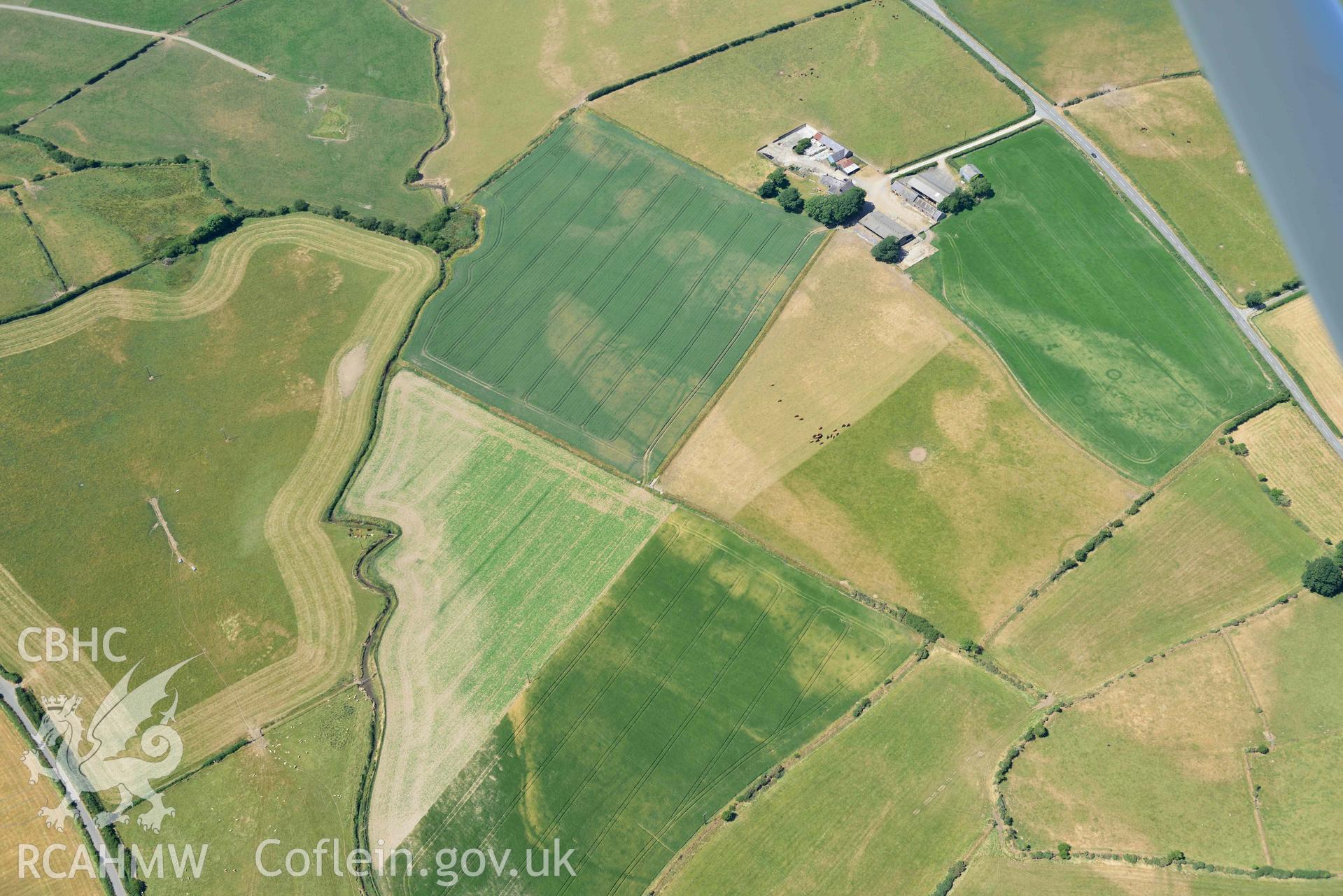 Aerial photograph: Bod-Nithoedd cropmark barrows, with larger ring ditch cropmark at SH 256 311. Crown: CHERISH PROJECT 2018. Produced with EU funds through the Ireland Wales Co-operation Programme 2014-2020 (NGR SH255312)