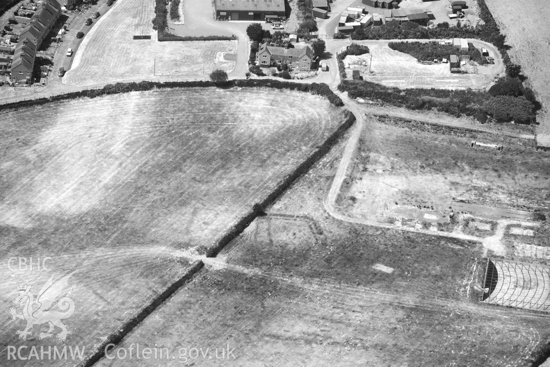 Aerial photograph: Cropmark defended enclosure, north-east of Polish Home, Penrhos airfield. Crown: CHERISH PROJECT 2018. Produced with EU funds through the Ireland Wales Co-operation Programme 2014-2020 (NGR SH339342)