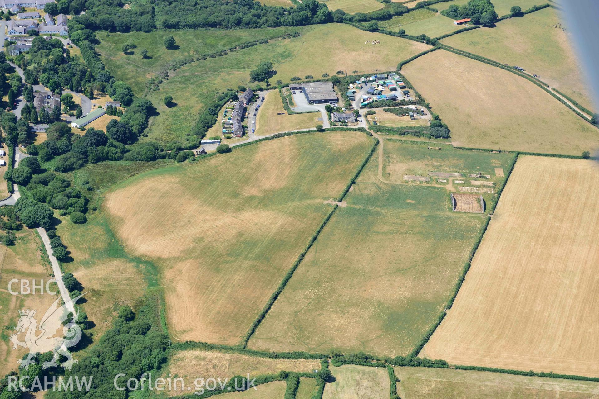 Aerial photograph: Cropmark defended enclosure, north-east of Polish Home, Penrhos airfield. Crown: CHERISH PROJECT 2018. Produced with EU funds through the Ireland Wales Co-operation Programme 2014-2020 (NGR SH339342)