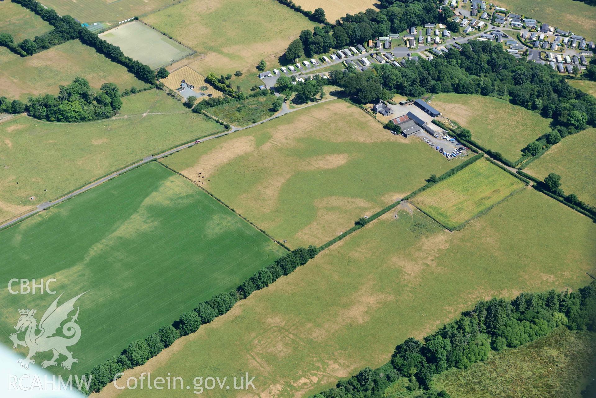 Aerial photograph: Pont Rhyd-hir defended enclosure cropmark. Crown: CHERISH PROJECT 2018. Produced with EU funds through the Ireland Wales Co-operation Programme 2014-2020 (NGR SH346355)