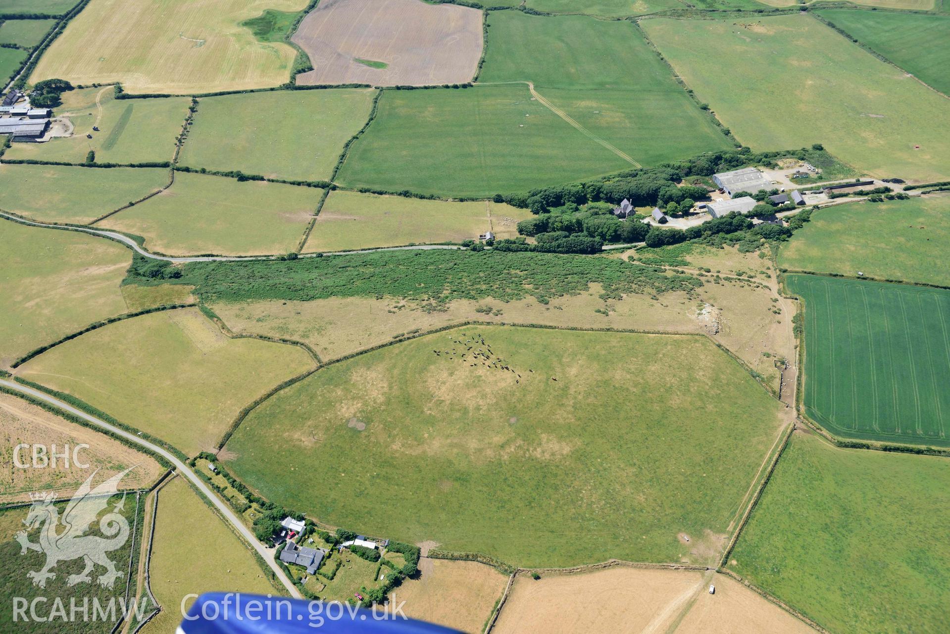 Aerial photograph: Mellionydd Enclosure, visible as a cropmark. Crown: CHERISH PROJECT 2018. Produced with EU funds through the Ireland Wales Co-operation Programme 2014-2020 (NGR SH218290)