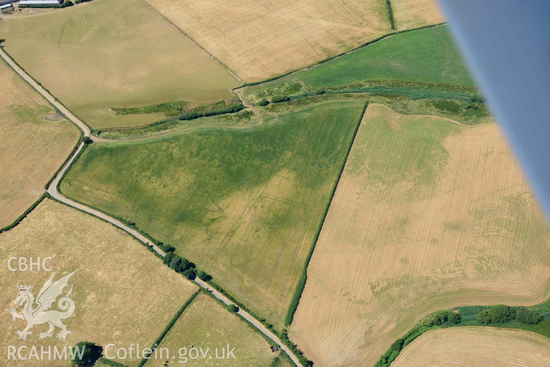 Aerial photograph: Tyddyn Llewelyn, cropmarks of field systems. Crown: CHERISH PROJECT 2018. Produced with EU funds through the Ireland Wales Co-operation Programme 2014-2020 (NGR SH344344)