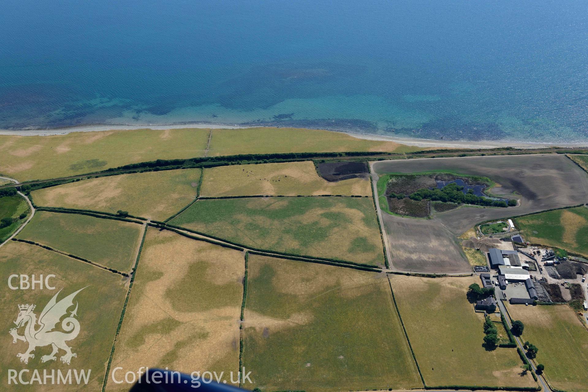 Aerial photograph: Glanllynnau early field system cropmarks, view from north. Crown: CHERISH PROJECT 2018. Produced with EU funds through the Ireland Wales Co-operation Programme 2014-2020 (NGR SH458376)