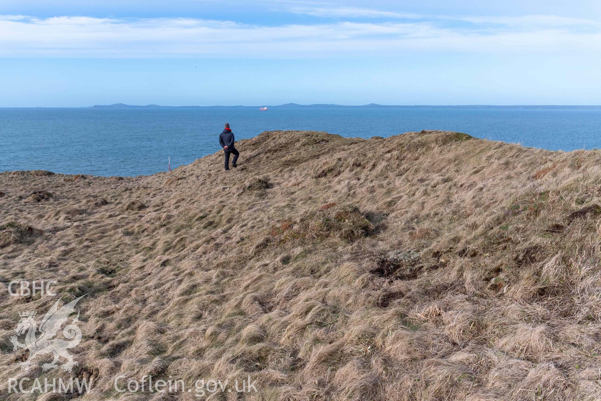 Tower Point Rath. Looking north along the stepped profile of the inner rampart bank to the north of the gateway (with scale).