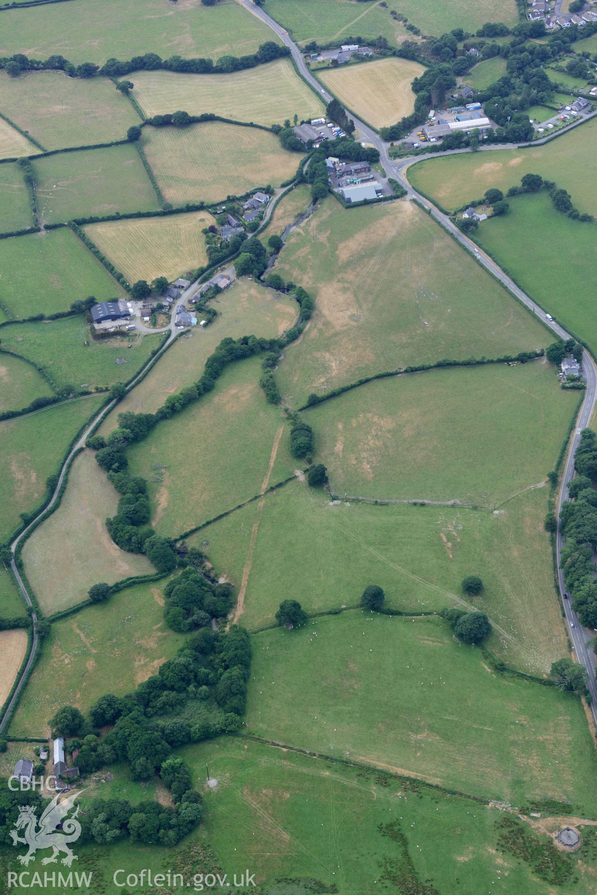 Aerial photograph: Bryncrug, Pont y Felindre cropmark complex, view from east. Crown: CHERISH PROJECT 2018. Produced with EU funds through the Ireland Wales Co-operation Programme 2014-2020 (NGR SH616031)