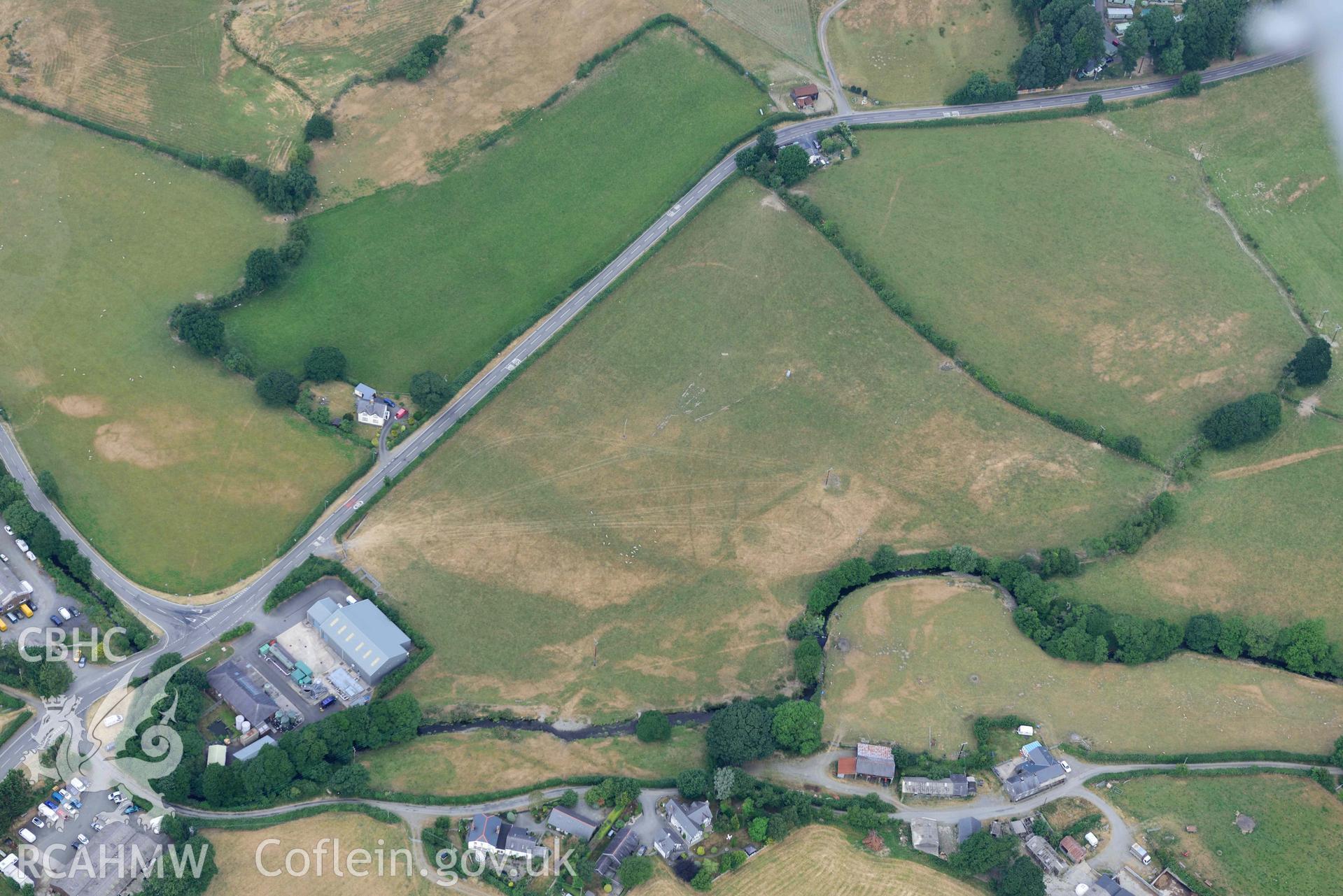 Aerial photograph: Bryncrug, Pont y Felindre cropmark complex. Crown: CHERISH PROJECT 2018. Produced with EU funds through the Ireland Wales Co-operation Programme 2014-2020 (NGR SH616031)