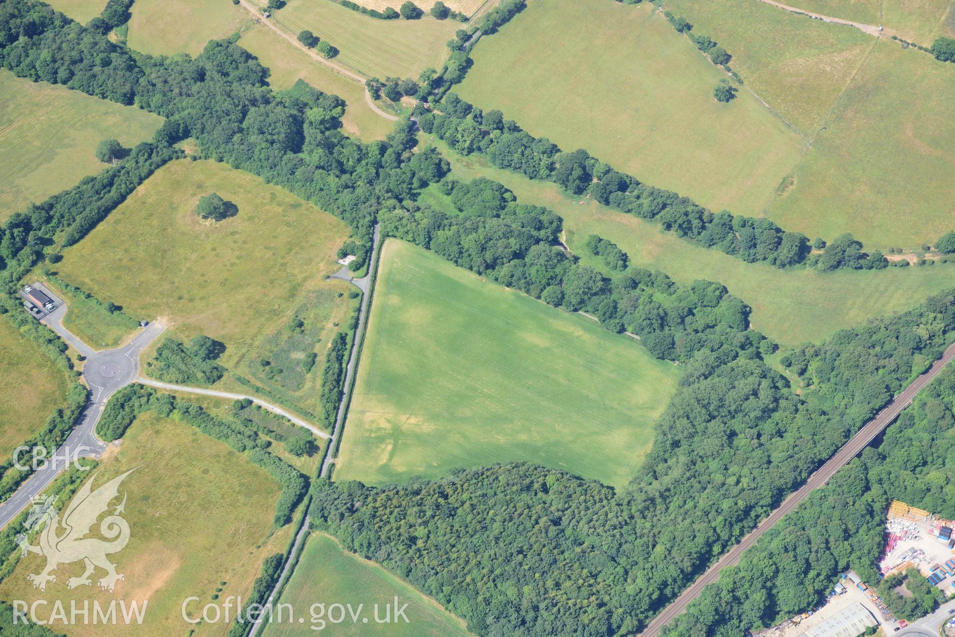 Aerial photograph: Parc Bryn Cegin oval cropmark enclosure. Wide view looking south-west. Crown: CHERISH PROJECT 2018. Produced with EU funds through the Ireland Wales Co-operation Programme 2014-2020 (NGR: SH588707)