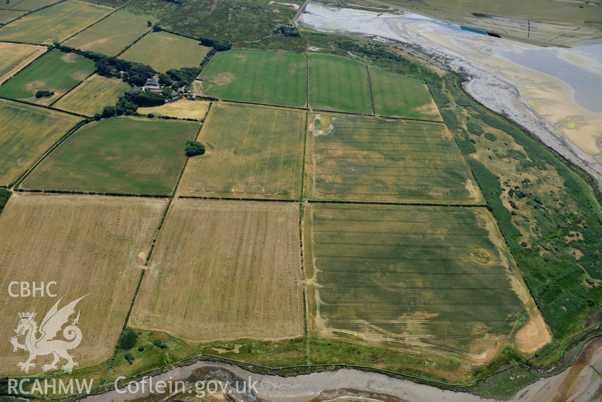 Aerial photograph: Cropmarks at Rhuddgaer. Crown: CHERISH PROJECT 2018. Produced with EU funds through the Ireland Wales Co-operation Programme 2014-2020 (NGR: SH441638)