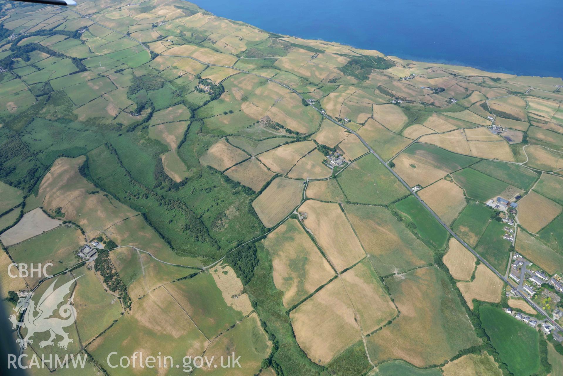 Aerial photograph: Rhos Rydd wetland, and Cardigan Bay coastal plain, view from northeast. Crown: CHERISH PROJECT 2018. Produced with EU funds through the Ireland Wales Co-operation Programme 2014-2020 (NGR: SN575745)