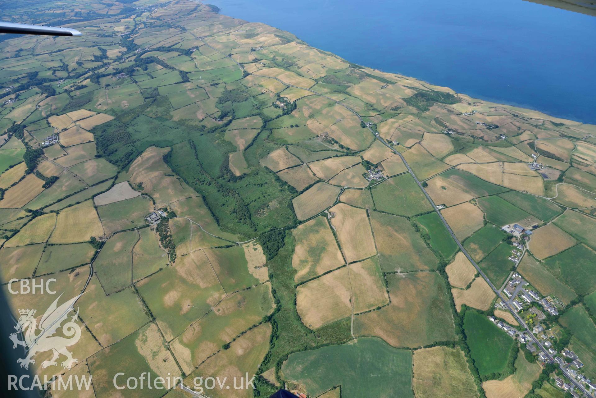 Aerial photograph: Rhos Rydd wetland, and Cardigan Bay coastal plain, view from northeast. Crown: CHERISH PROJECT 2018. Produced with EU funds through the Ireland Wales Co-operation Programme 2014-2020 (NGR: SN575745)