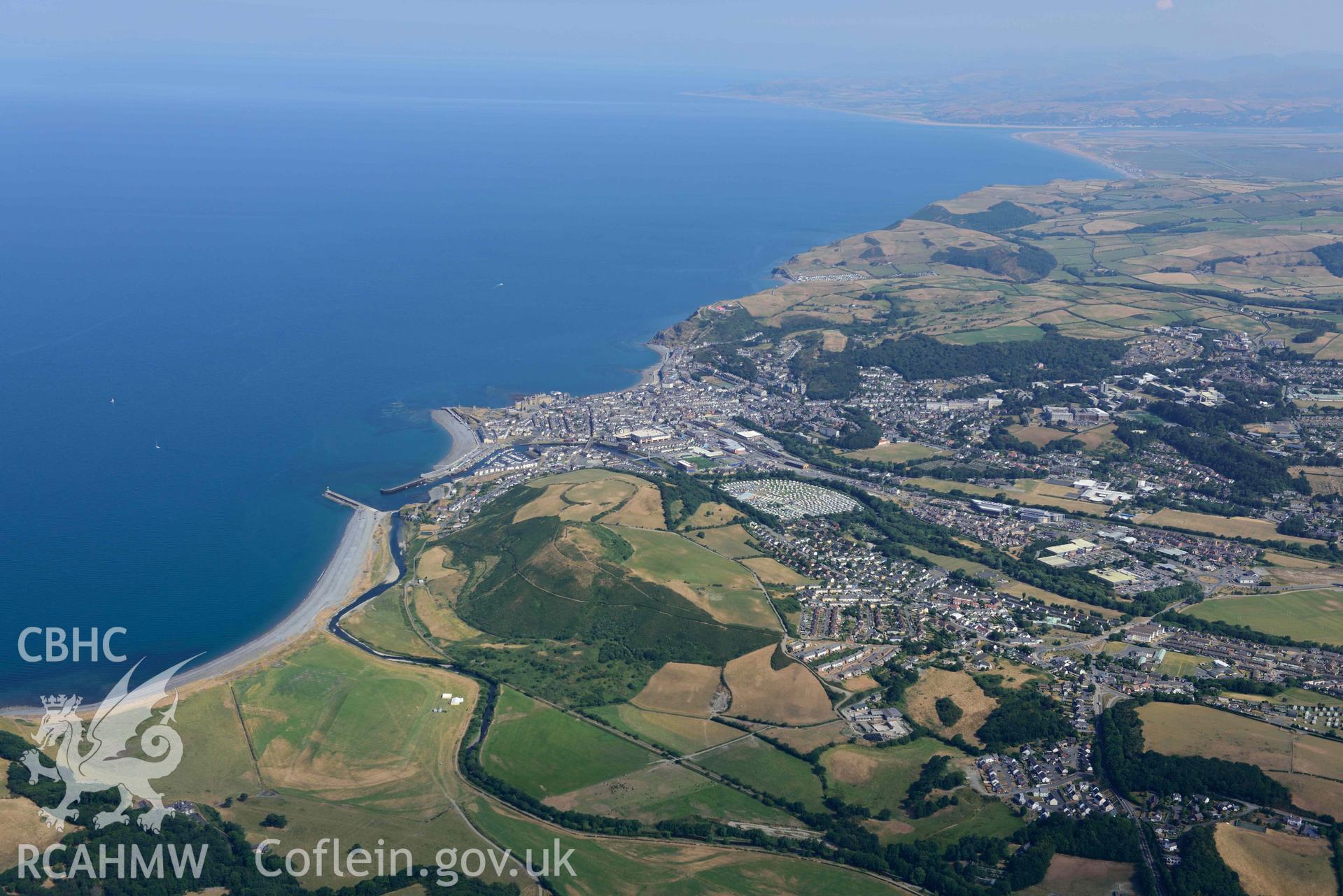 Aerial photograph: Pendinas hillfort, and Aberystwyth, in drought conditions. Crown: CHERISH PROJECT 2018. Produced with EU funds through the Ireland Wales Co-operation Programme 2014-2020 (NGR: SN584802)