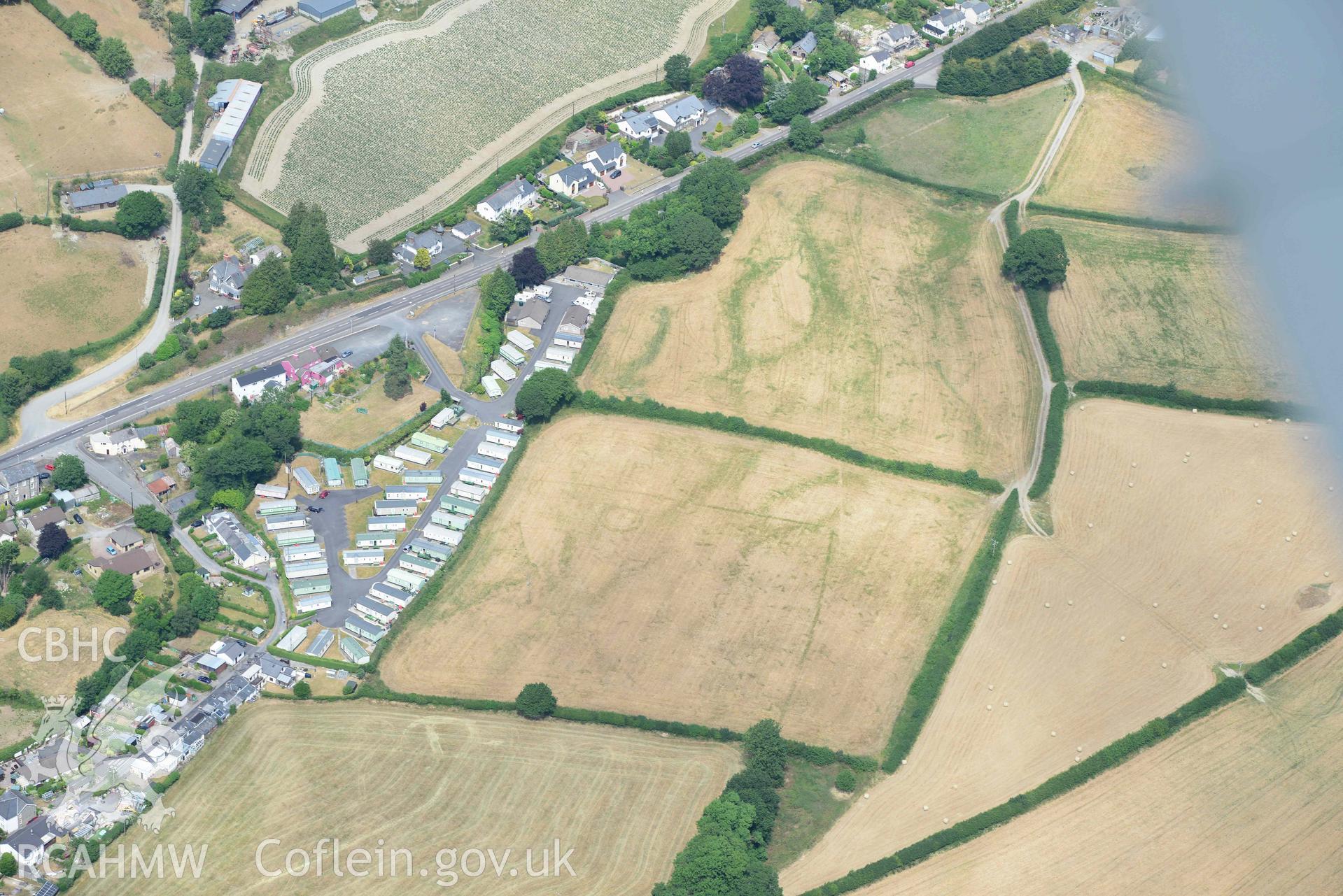 Aerial photograph: Dolypandy round barrow cropmarks, view looking east. Crown: CHERISH PROJECT 2018. Produced with EU funds through the Ireland Wales Co-operation Programme 2014-2020 (NGR SN662800)