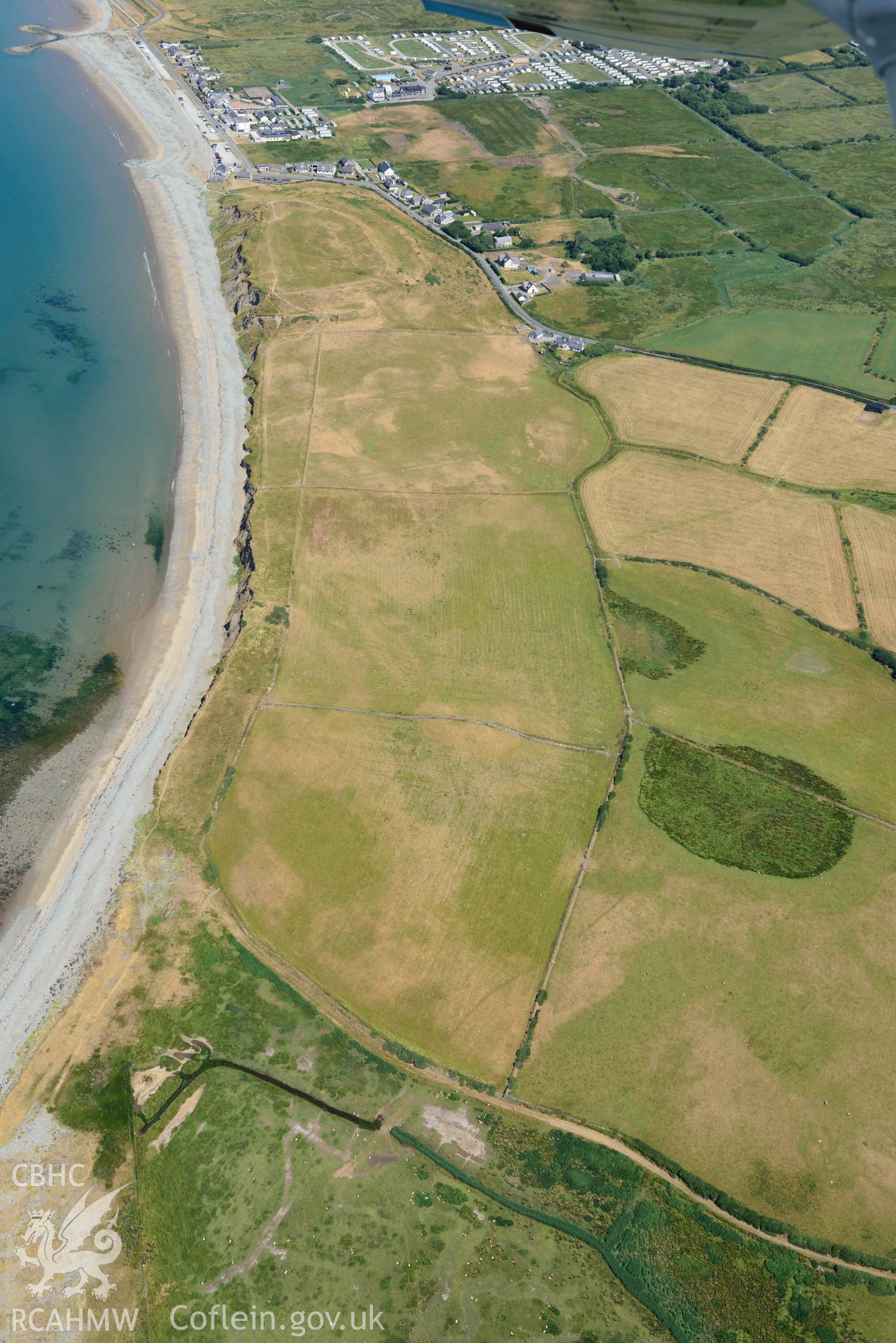 Aerial photograph: Field system south of Dinas Dinlle, view from south. Crown: CHERISH PROJECT 2018. Produced with EU funds through the Ireland Wales Co-operation Programme 2014-2020 (NGR: SH436557)