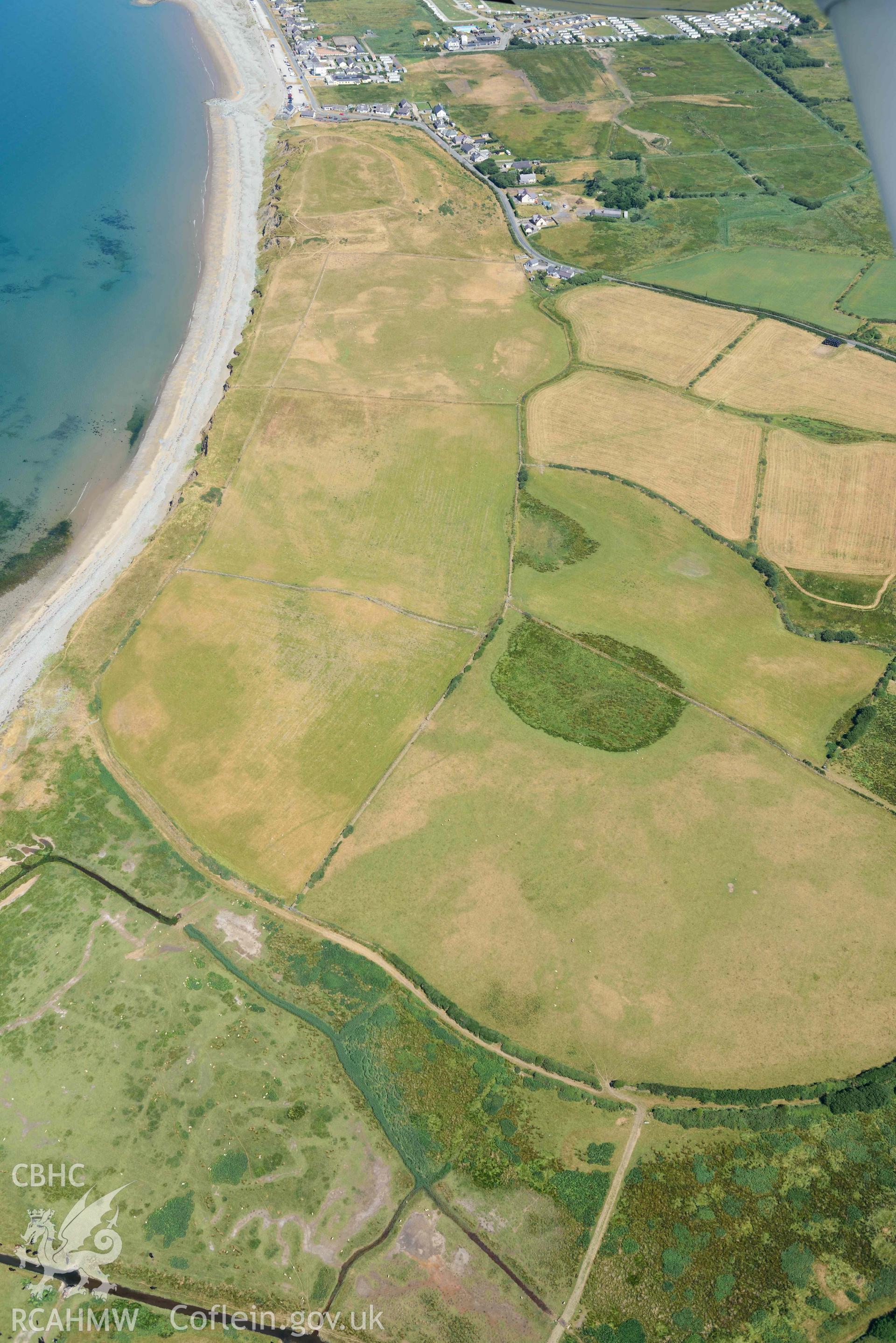 Aerial photograph: Field system south of Dinas Dinlle, view from southeast. Crown: CHERISH PROJECT 2018. Produced with EU funds through the Ireland Wales Co-operation Programme 2014-2020 (NGR: SH436557)