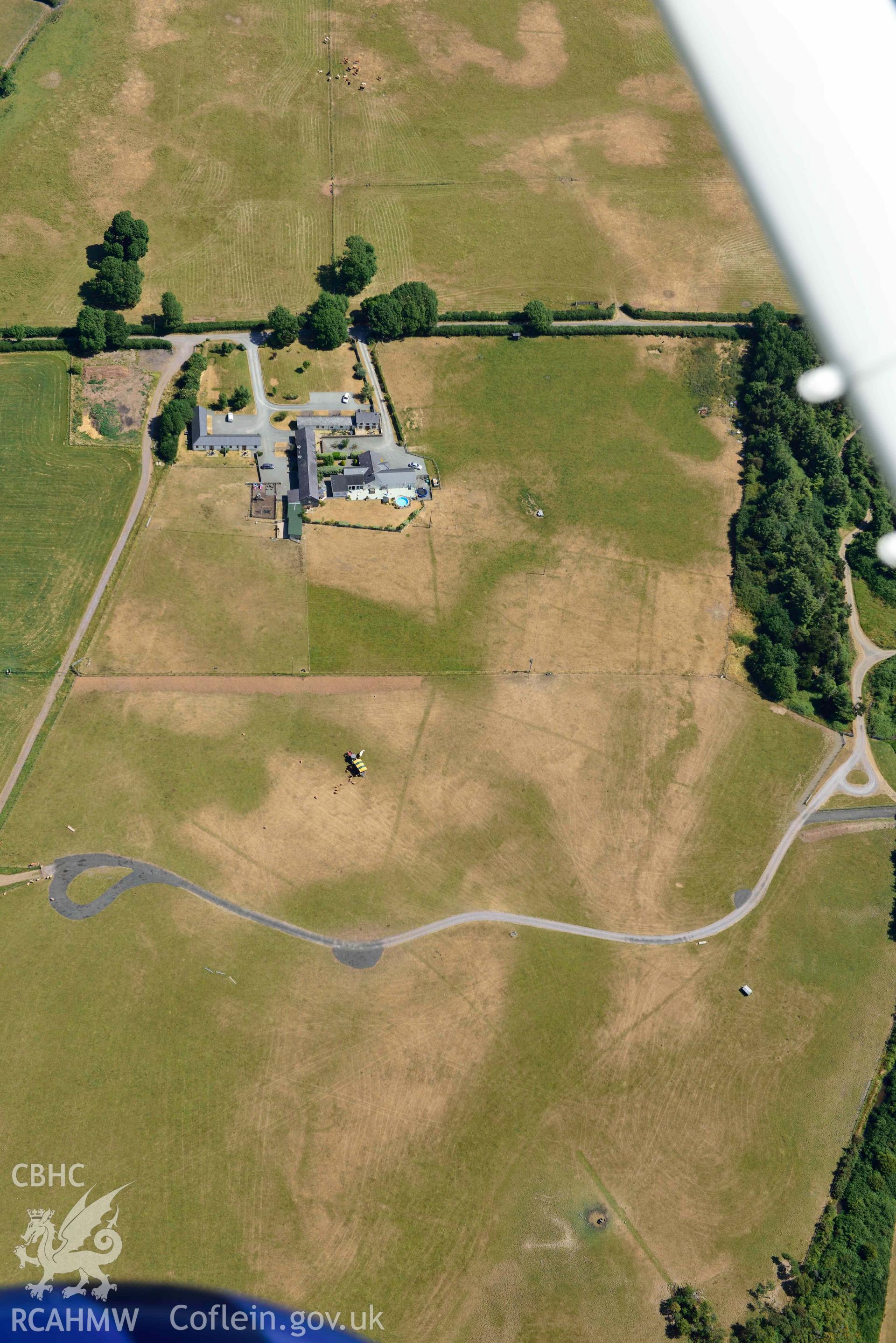 Aerial photograph: Tai Cochion Roman settlement, parchmarks of boundaries. Crown: CHERISH PROJECT 2018. Produced with EU funds through the Ireland Wales Co-operation Programme 2014-2020 (NGR: SH479656)
