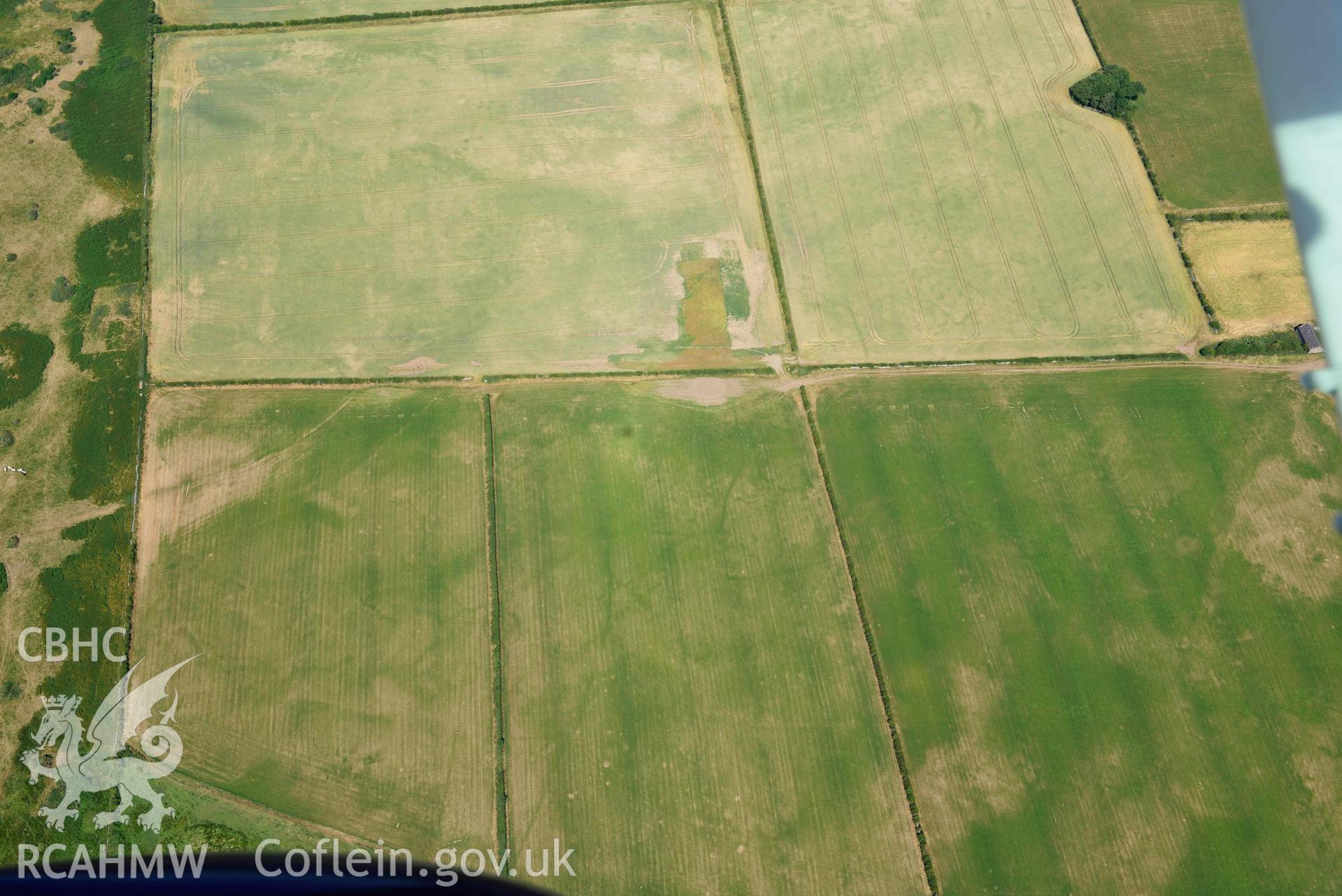 Aerial photograph: Cropmarks at Rhuddgaer. Crown: CHERISH PROJECT 2018. Produced with EU funds through the Ireland Wales Co-operation Programme 2014-2020 (NGR: SH441638)