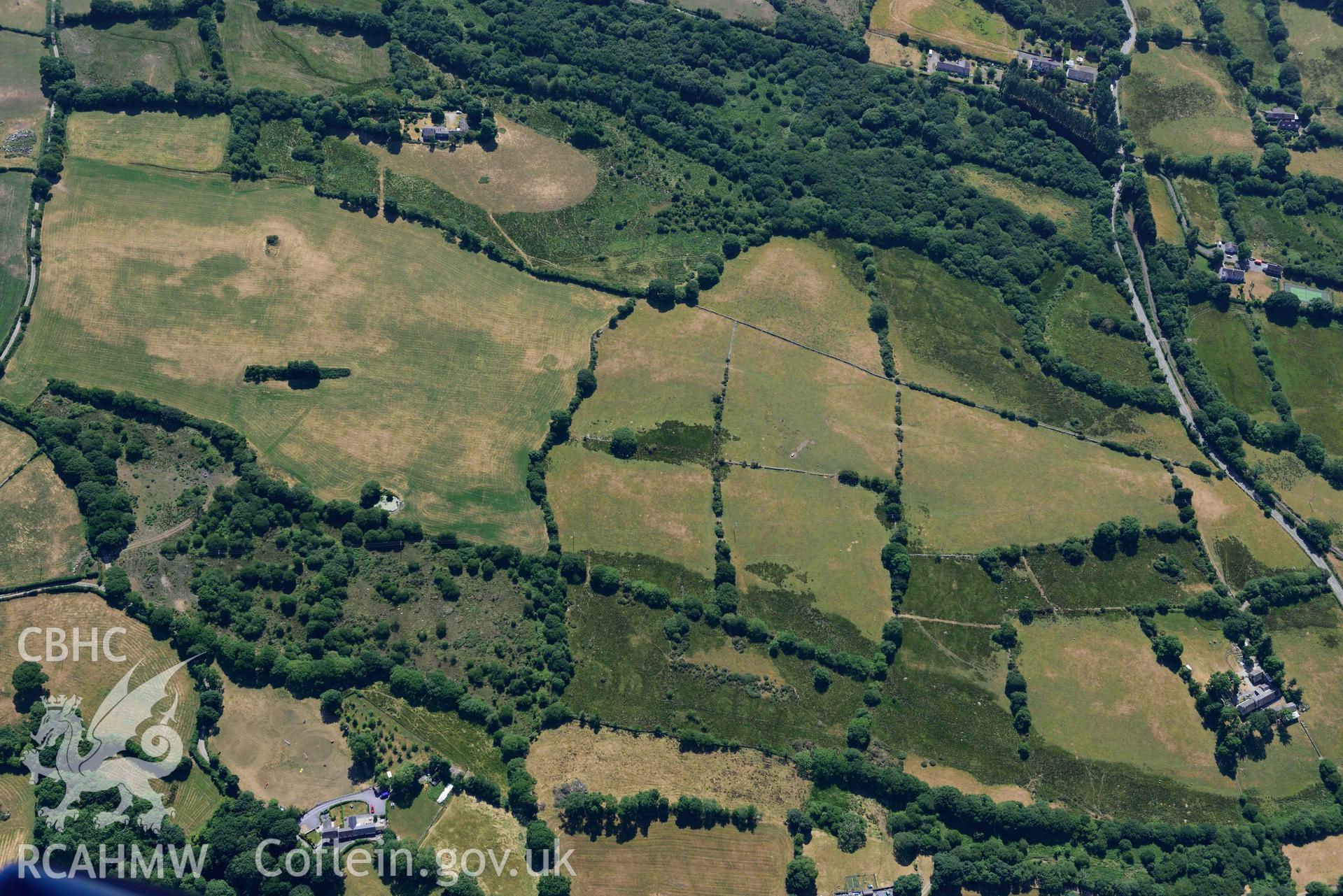 Aerial photograph: Roman road passing through Rhos Isaf. Parchmarks of quary pits near Tyddyn Berth. Crown: CHERISH PROJECT 2018. Produced with EU funds through the Ireland Wales Co-operation Programme 2014-2020 (NGR: SH491589)