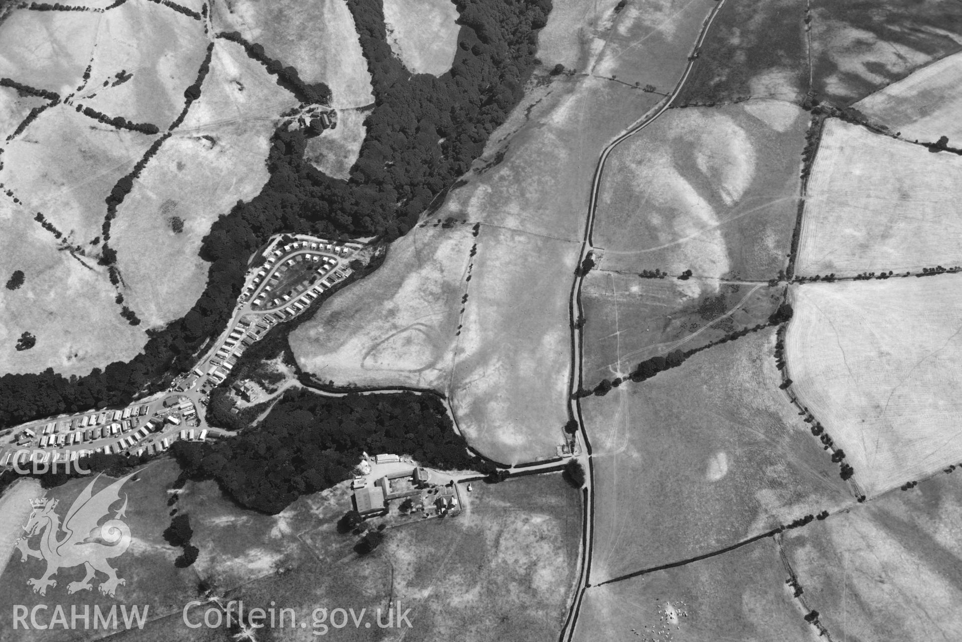 Aerial photograph: Glan Fred defended enclosure. Wide view with surrounding fields. Crown: CHERISH PROJECT 2018. Produced with EU funds through the Ireland Wales Co-operation Programme 2014-2020 (NGR: SN634878)