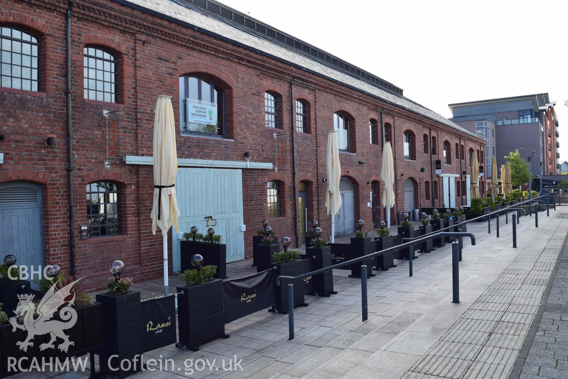 Photograph from an assessment of heritage impact on the setting of the J Shed Listed Building of seating at the Rasoi Waterfront restaurant, Waterfront, Swansea, carried out by Trysor in 2021. Trysor Project No. 2021/783.