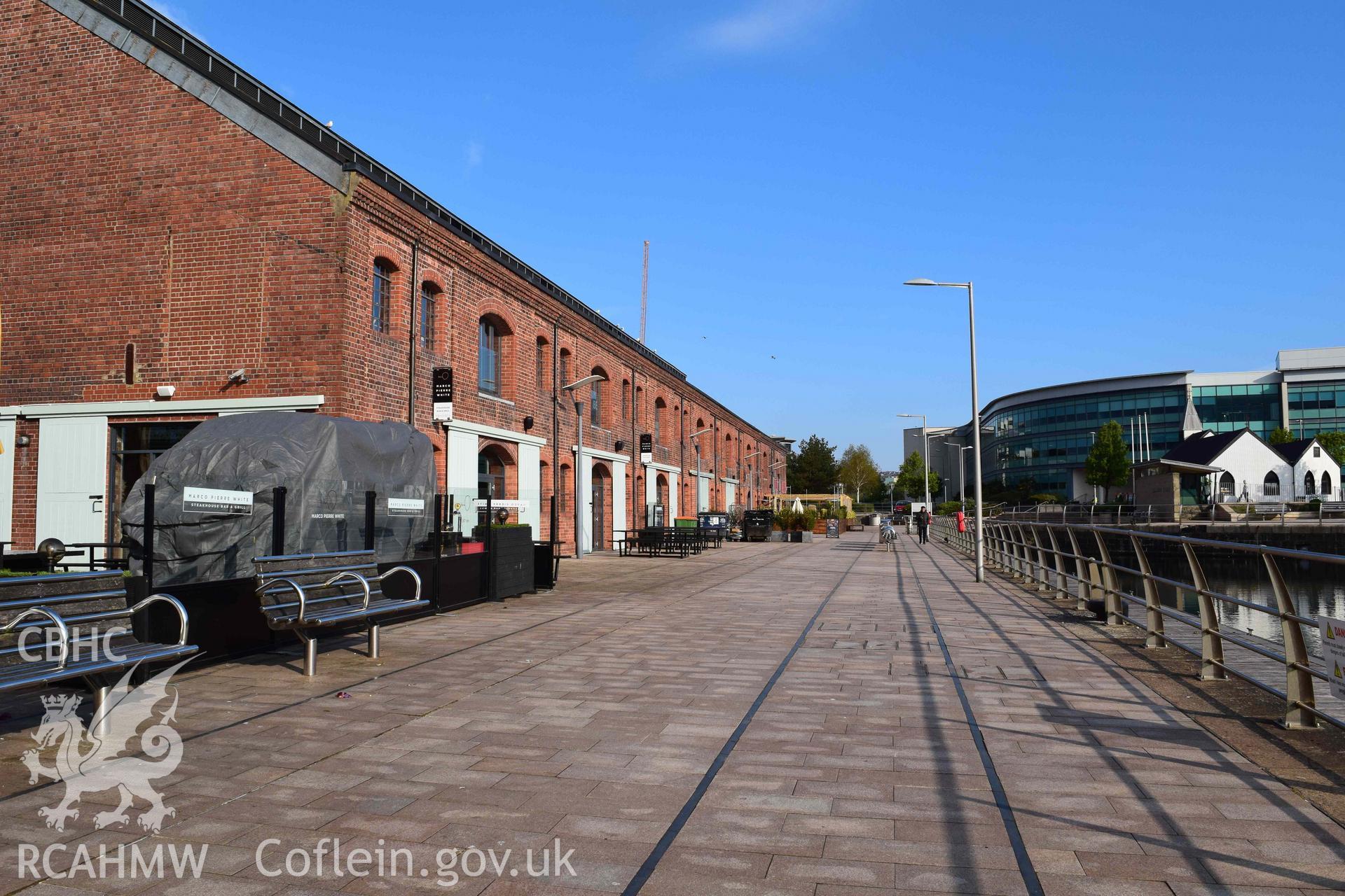 Photograph from an assessment of heritage impact on the setting of the J Shed Listed Building of seating at the Rasoi Waterfront restaurant, Waterfront, Swansea, carried out by Trysor in 2021. Trysor Project No. 2021/783.