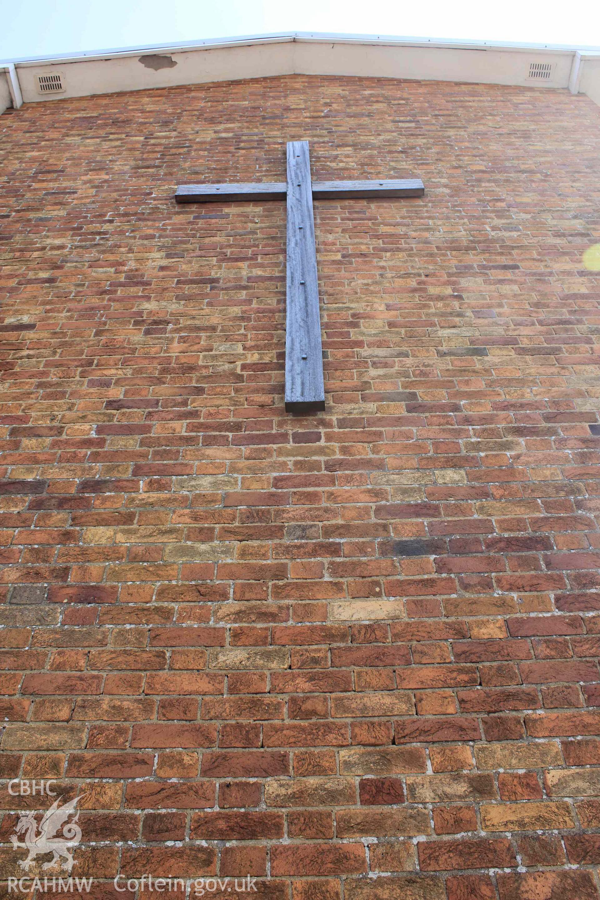 Church exterior. Cross on west side. Portrait orientation