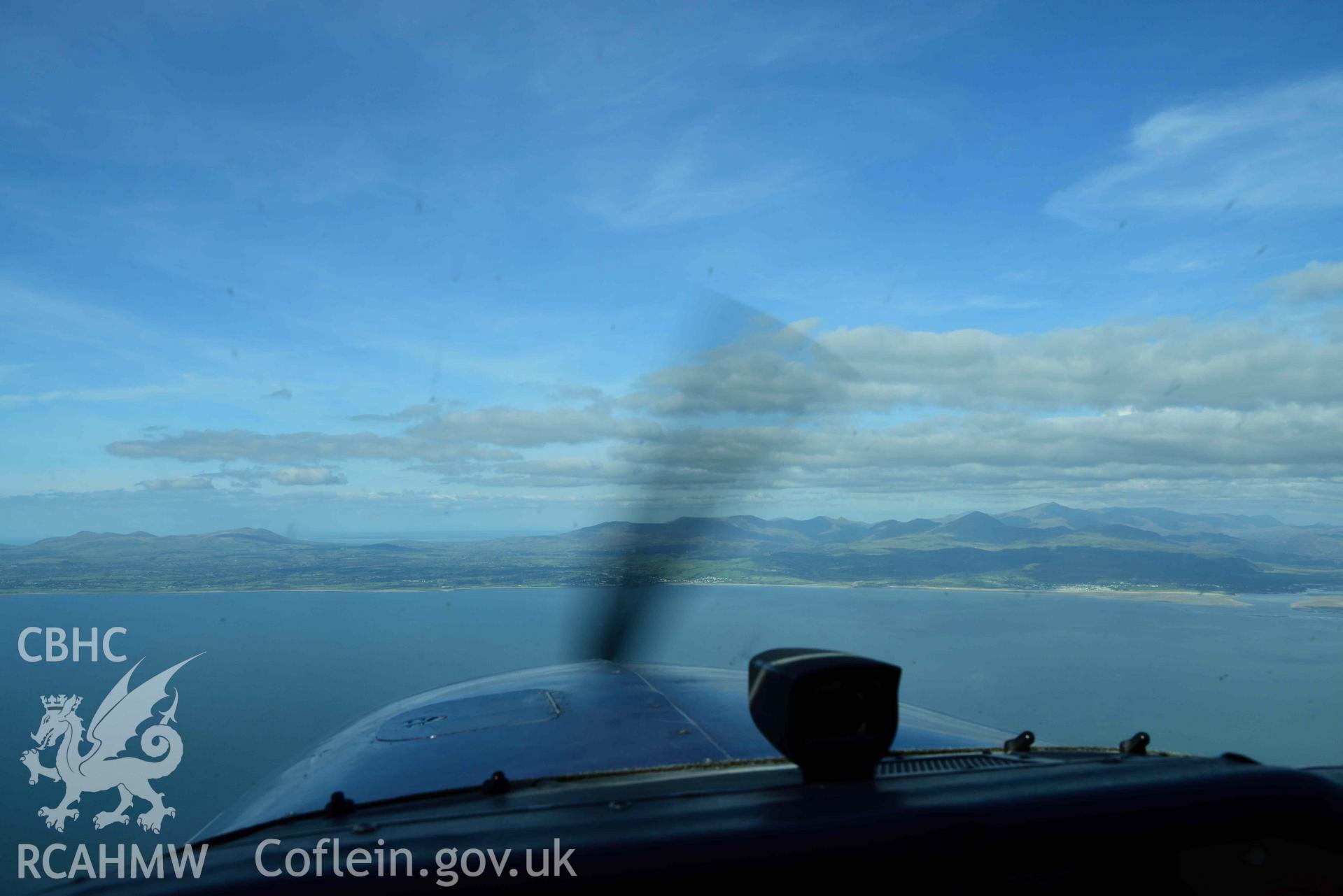 Cessna 172, cockpit view in flight over Tremadog Bay with Morfa Bychan and Eryri/Snowdonia beyond